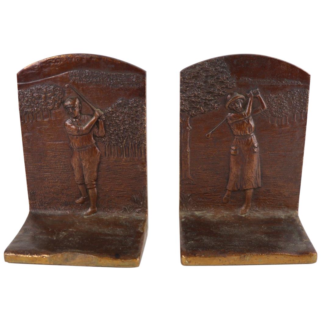 Classic Art Deco bronze attributed to Griffoul depicting a male golfer on one, and a female golfer on the other. Dimensions in listing are per bookend.