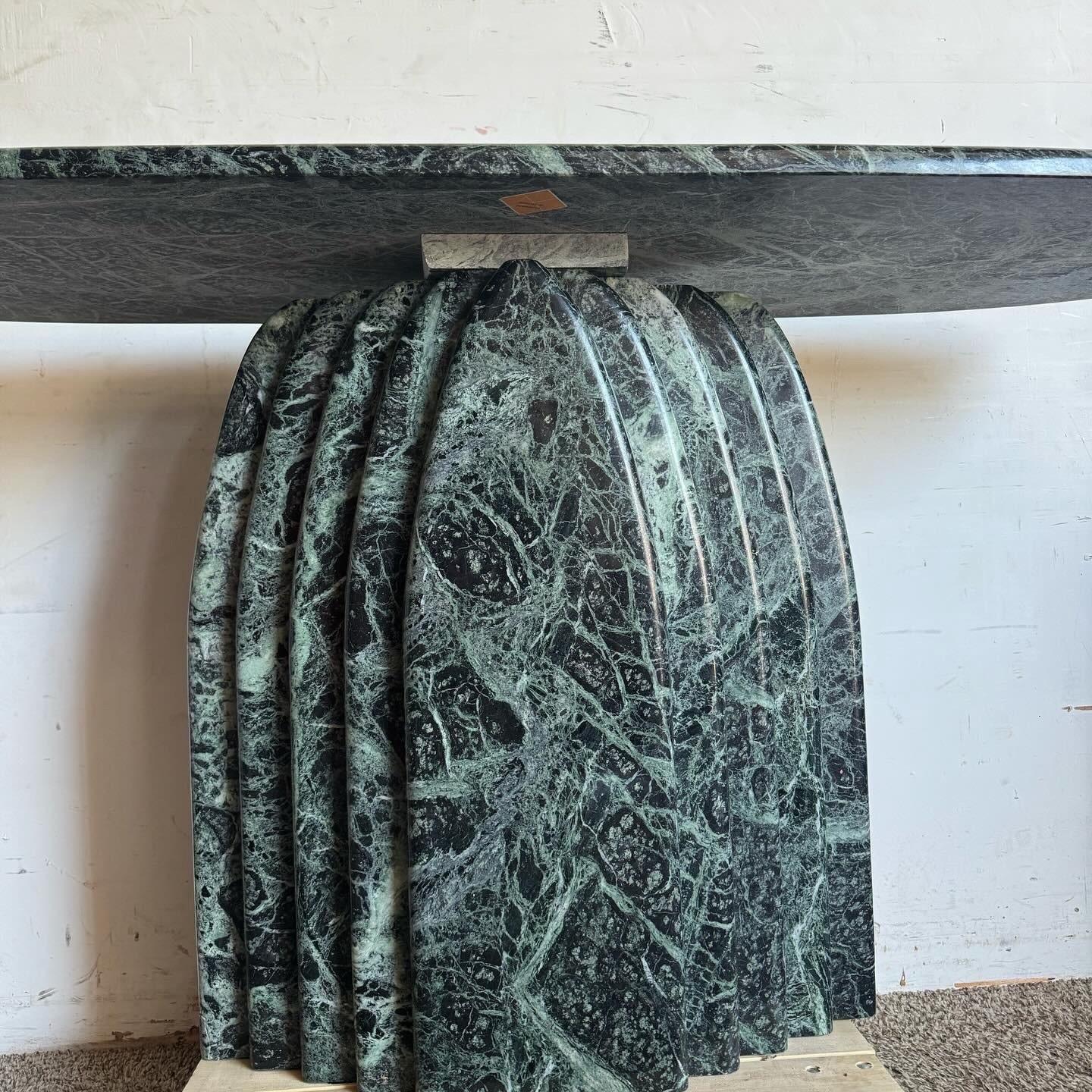 Elevate your home with the timeless elegance of this Art Deco Green Belgian Marble Console Table, featuring a scalloped base. Combining the classic sophistication of Art Deco design with the luxurious appeal of rich, green Belgian marble, this table