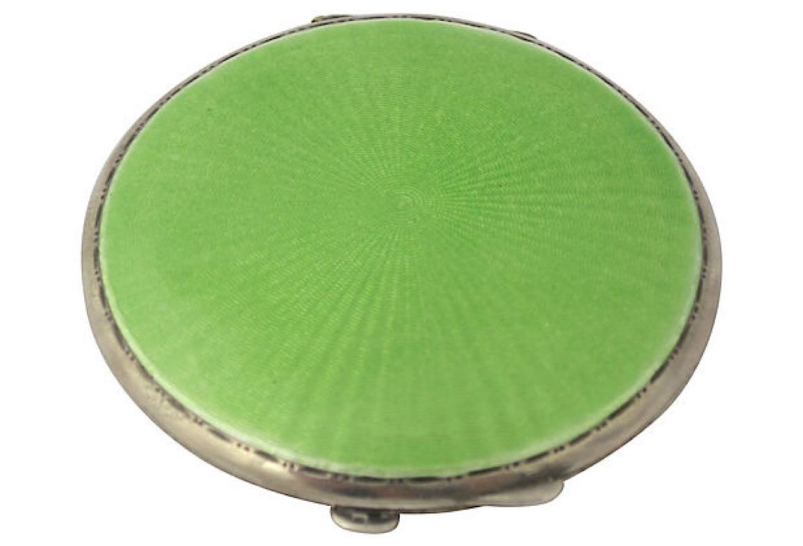 English Art Deco sterling silver compact by Turner & Simpson, 1934. Features a round green engine-turned guilloche enamel sunburst lid with an etched dot and line frame; inside is a round mirror (with yellow age spots) and an area for powder that