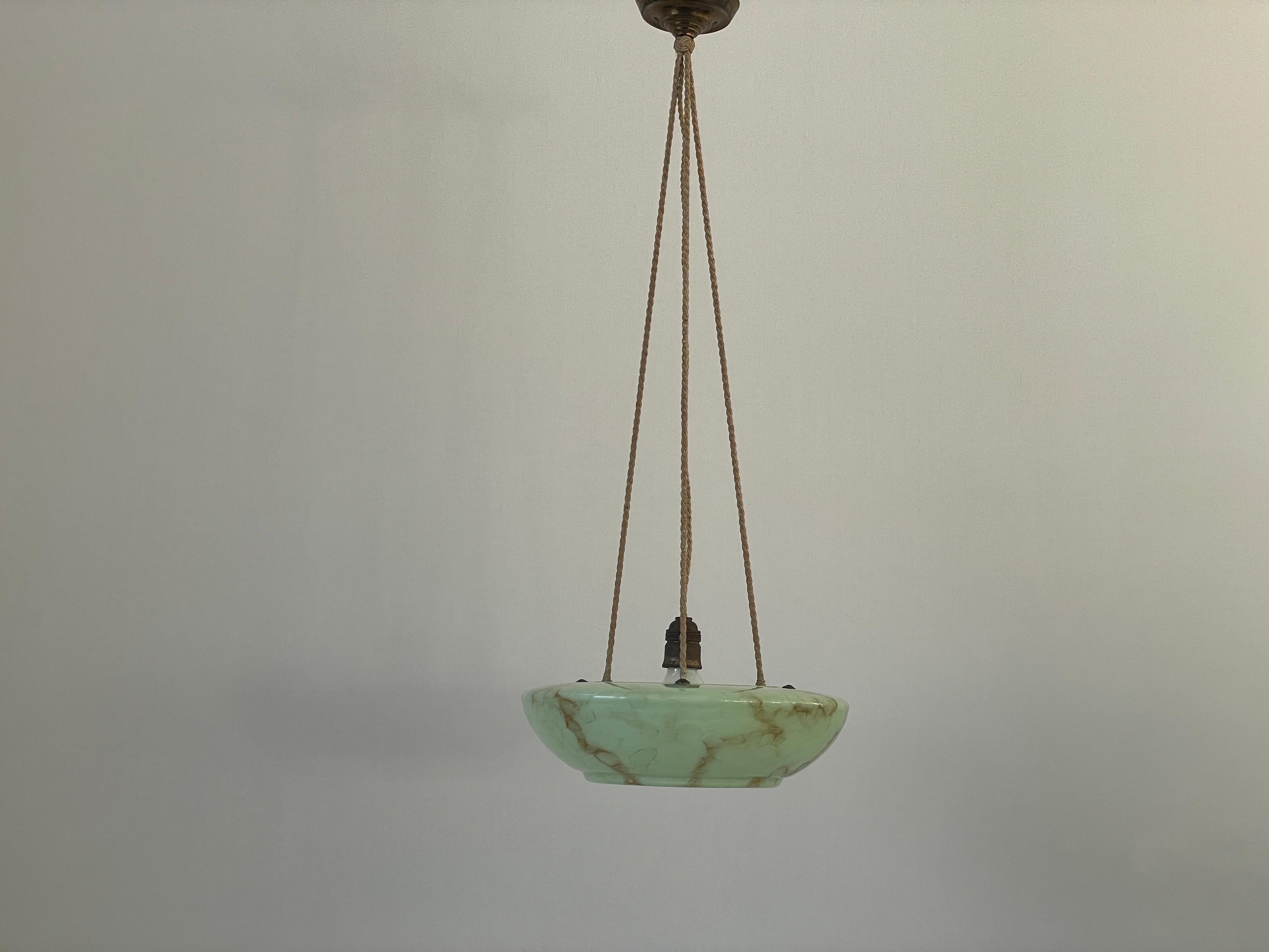 Art Deco Green Glass Ceiling Lamp, 1940s, Germany

Lampshade is in very good vintage condition.

This lamp works with E27 light bulbs. 
Wired and suitable to use with 220V and 110V for all countries.

Measurements: 
Height: 87 cm
Shade diameter and