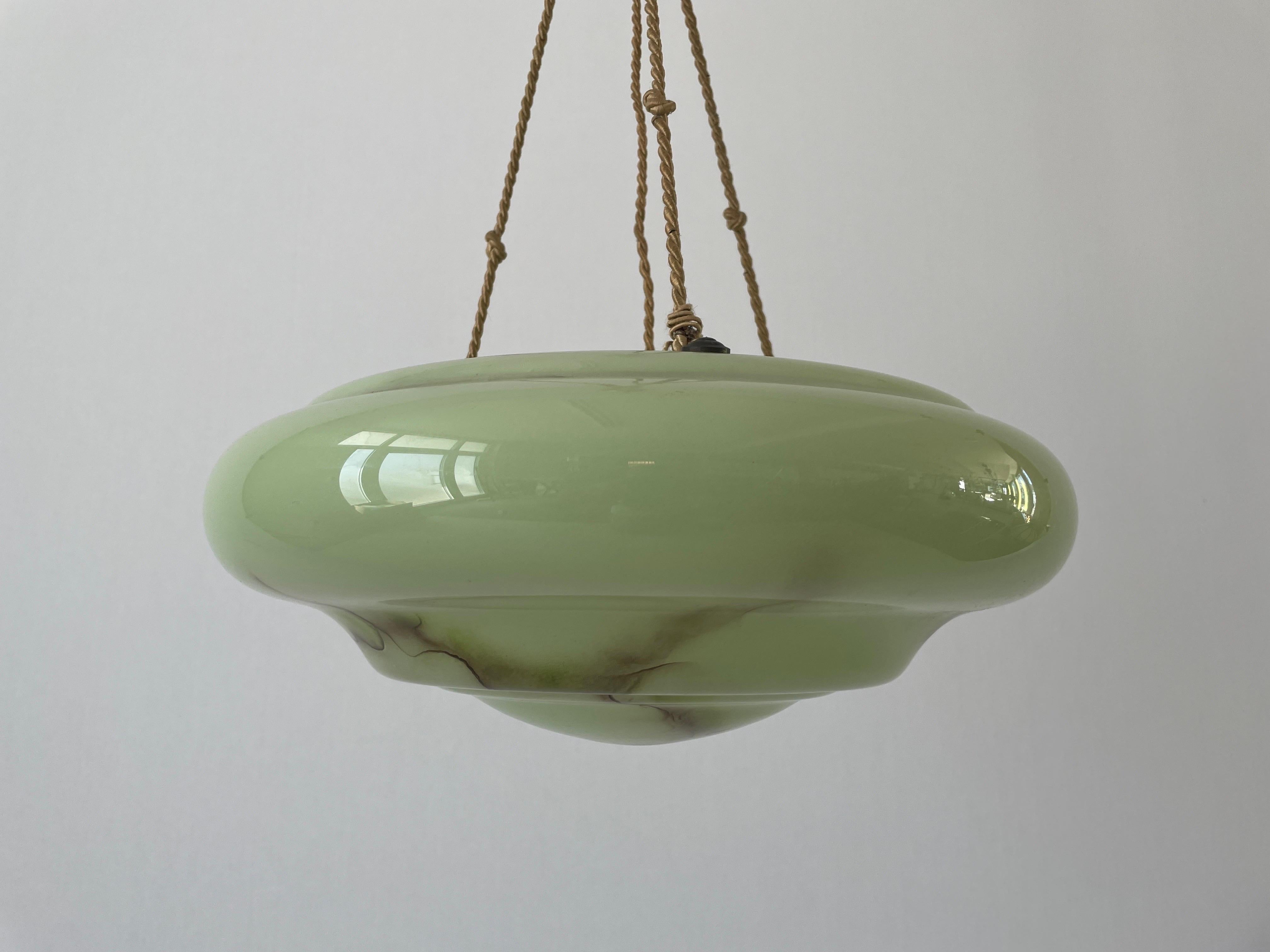 Art Deco Green Glass Ceiling Lamp with hanging ropes, 1940s, Germany

Lampshade is in very good vintage condition.

This lamp works with E27 light bulbs. 
Wired and suitable to use with 220V and 110V for all countries.

Measurements: 
Height: 74