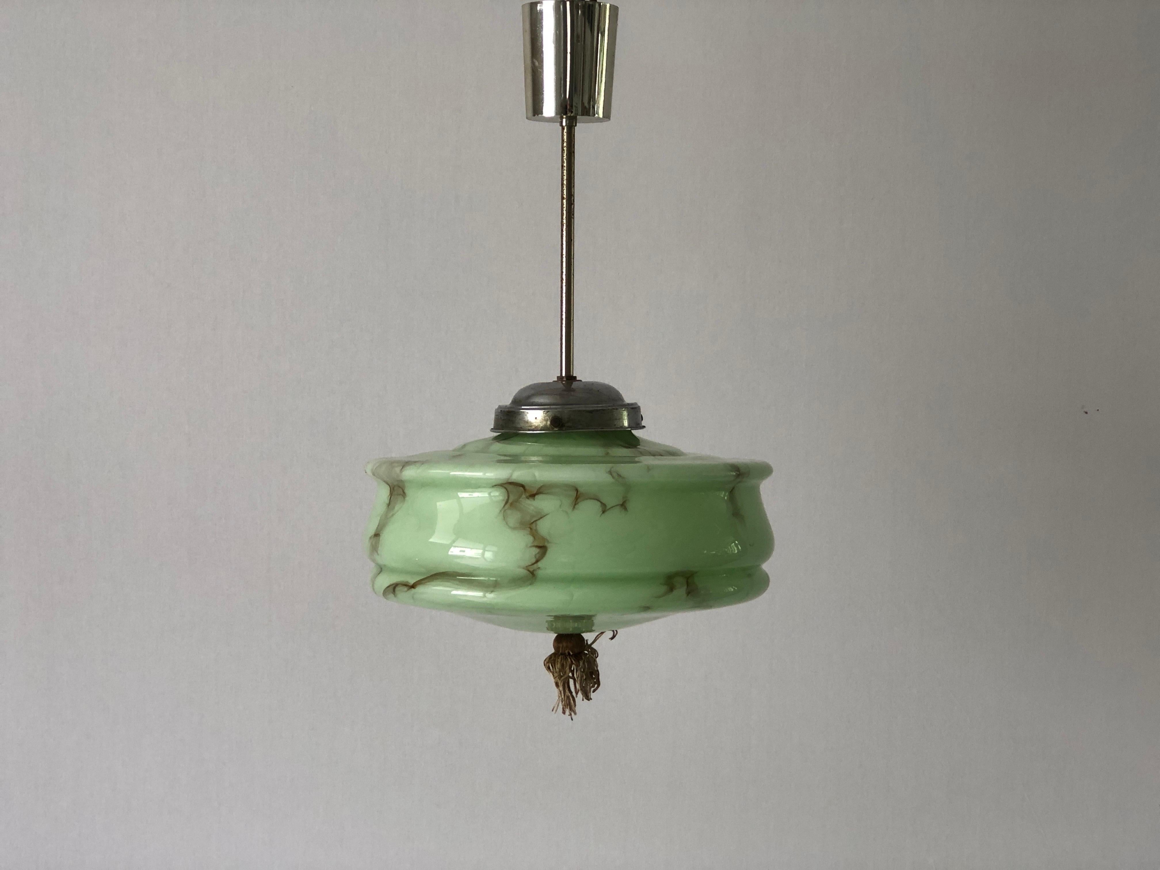 Art Deco Green Glass Ceiling Lamp by VEB Leuchten, 1940s, Germany

Lampshade is in very good vintage condition.

This lamp works with E27 light bulbs. 
Wired and suitable to use with 220V and 110V for all countries.

Measurements: 
Height: 43