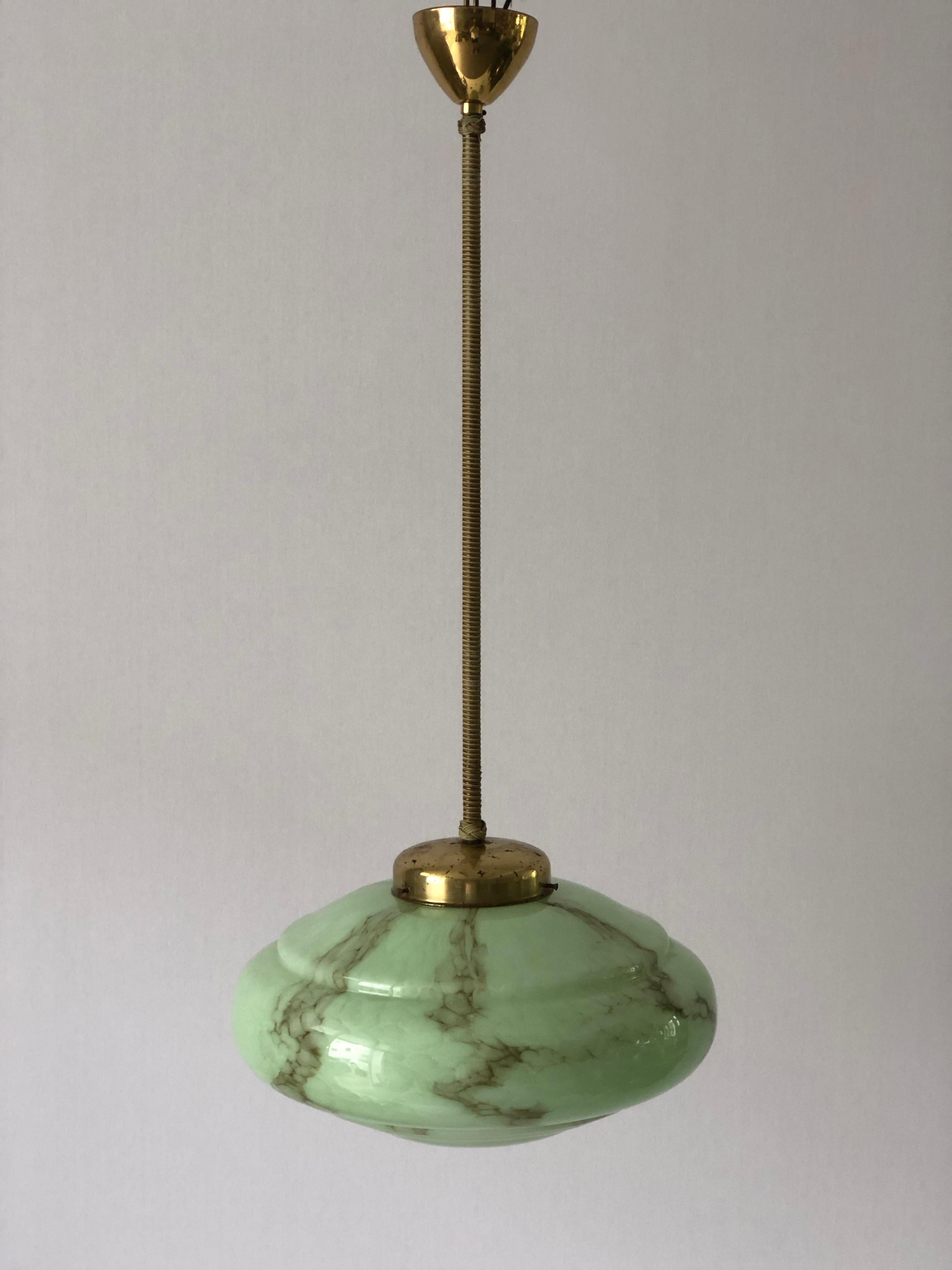 Art Deco Green Glass Ceiling Lamp by VEB Leuchten, 1940s, Germany

Lampshade is in very good vintage condition.

This lamp works with E27 light bulbs. 
Wired and suitable to use with 220V and 110V for all countries.

Measurements: 
Height: 74