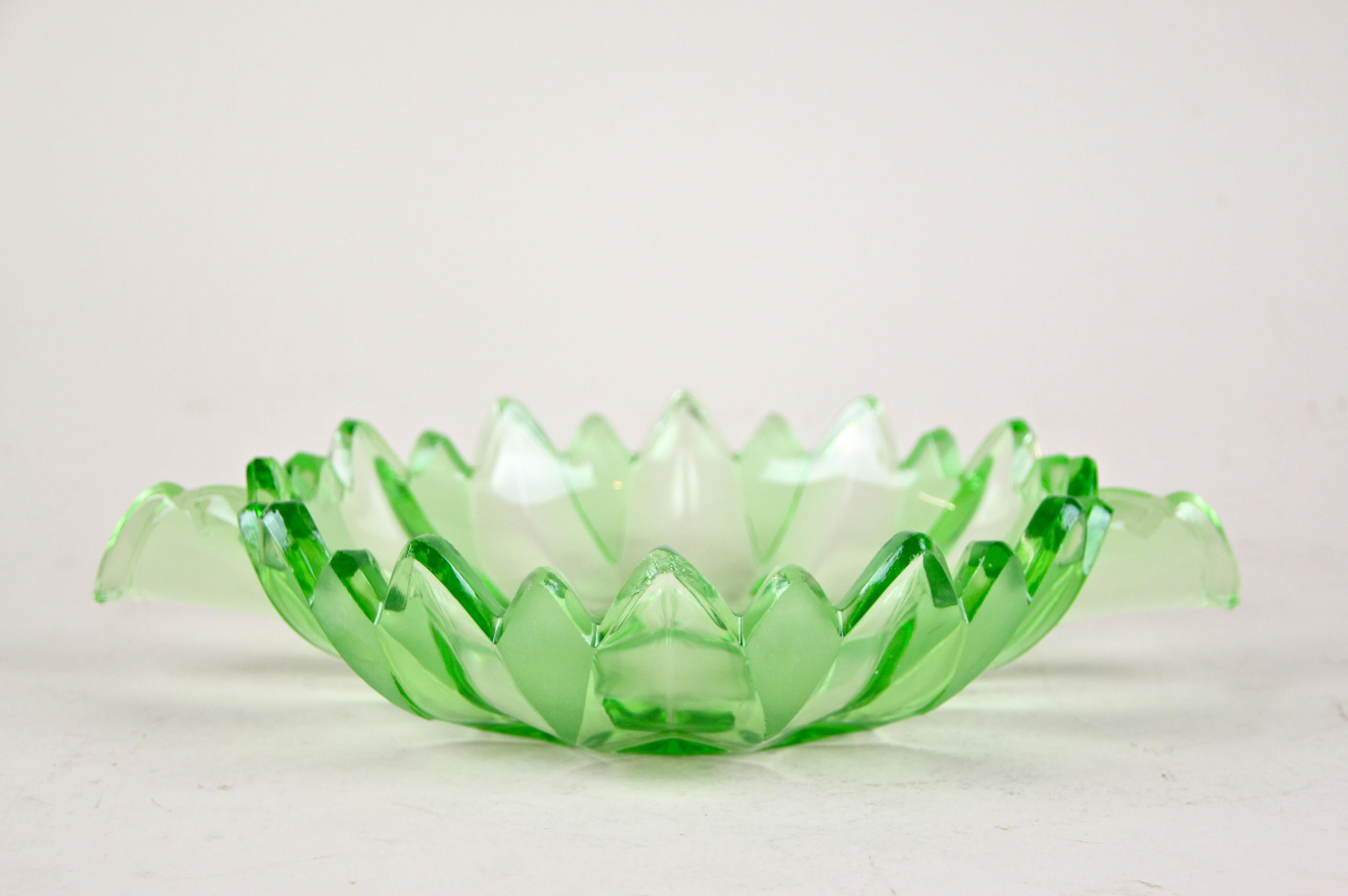 Delicate Art Deco glass centerpiece out of Austria from the period, circa 1930. Colored in a beautiful rose tone, this very decorative glass centerpiece impresses with its shape and charming design elements. The artfully glass bowl offers space for