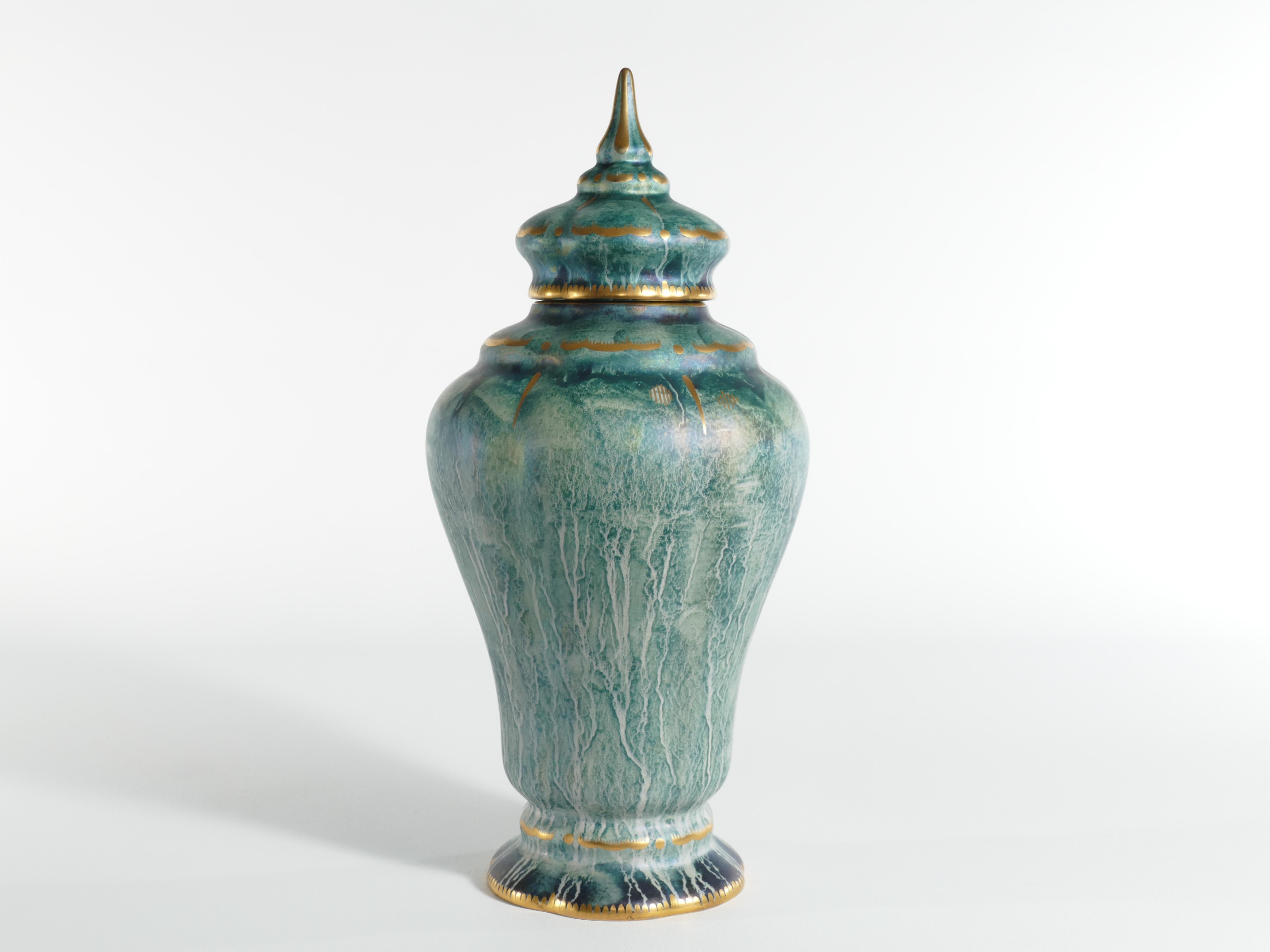 This large and exquisite handmade lidded vase, is skillfully crafted by the renowned Swedish ceramic artist Josef Ekberg. He is recognized as one of Sweden's foremost ceramic artists during his era.

This particular piece is a splendid