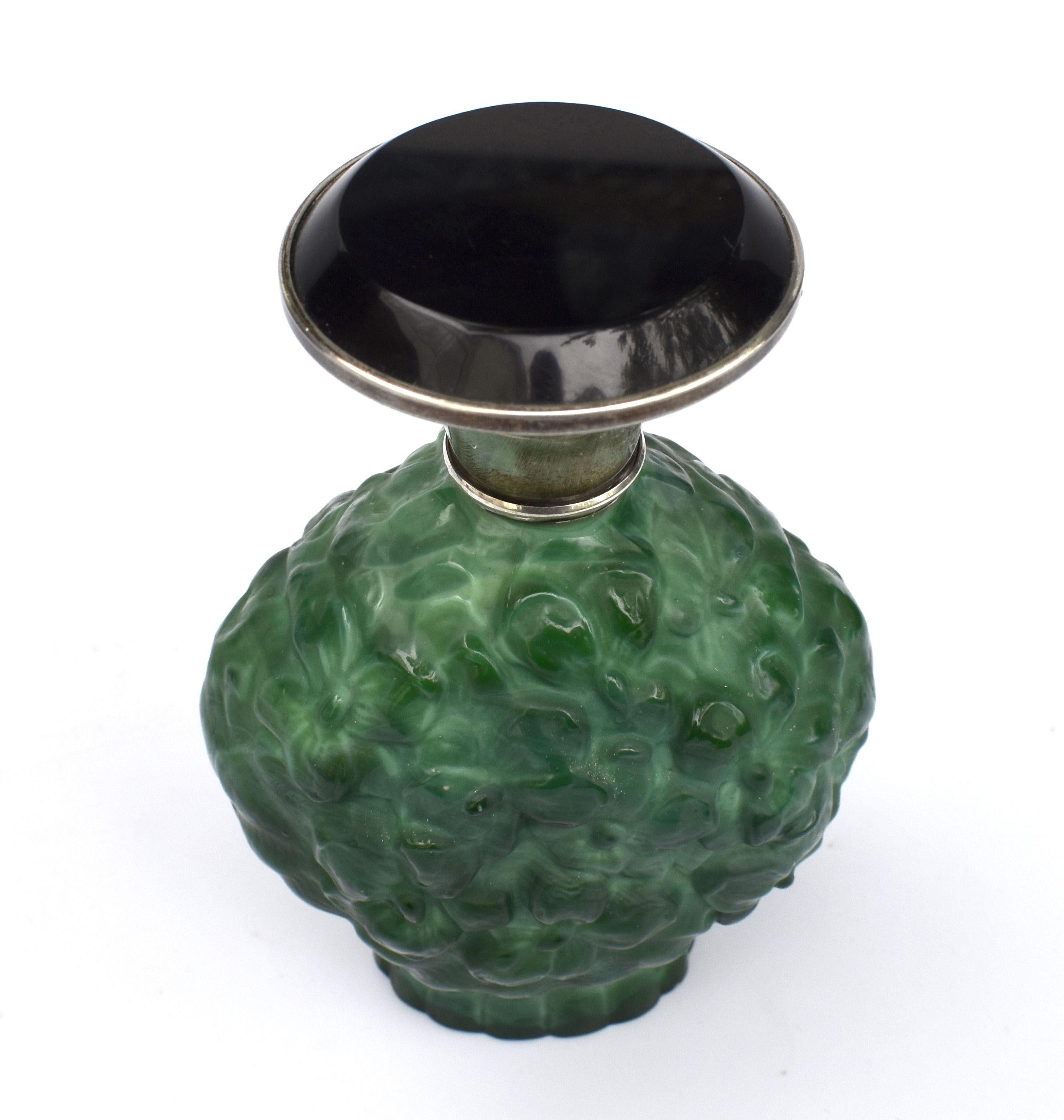 Beautiful and original 1930's large Art Deco green malachite glass perfume bottle with solid silver and black glass lid. Made in Czechoslovakia. This wonderful piece comes to you in excellent condition with no flaws to mention.
