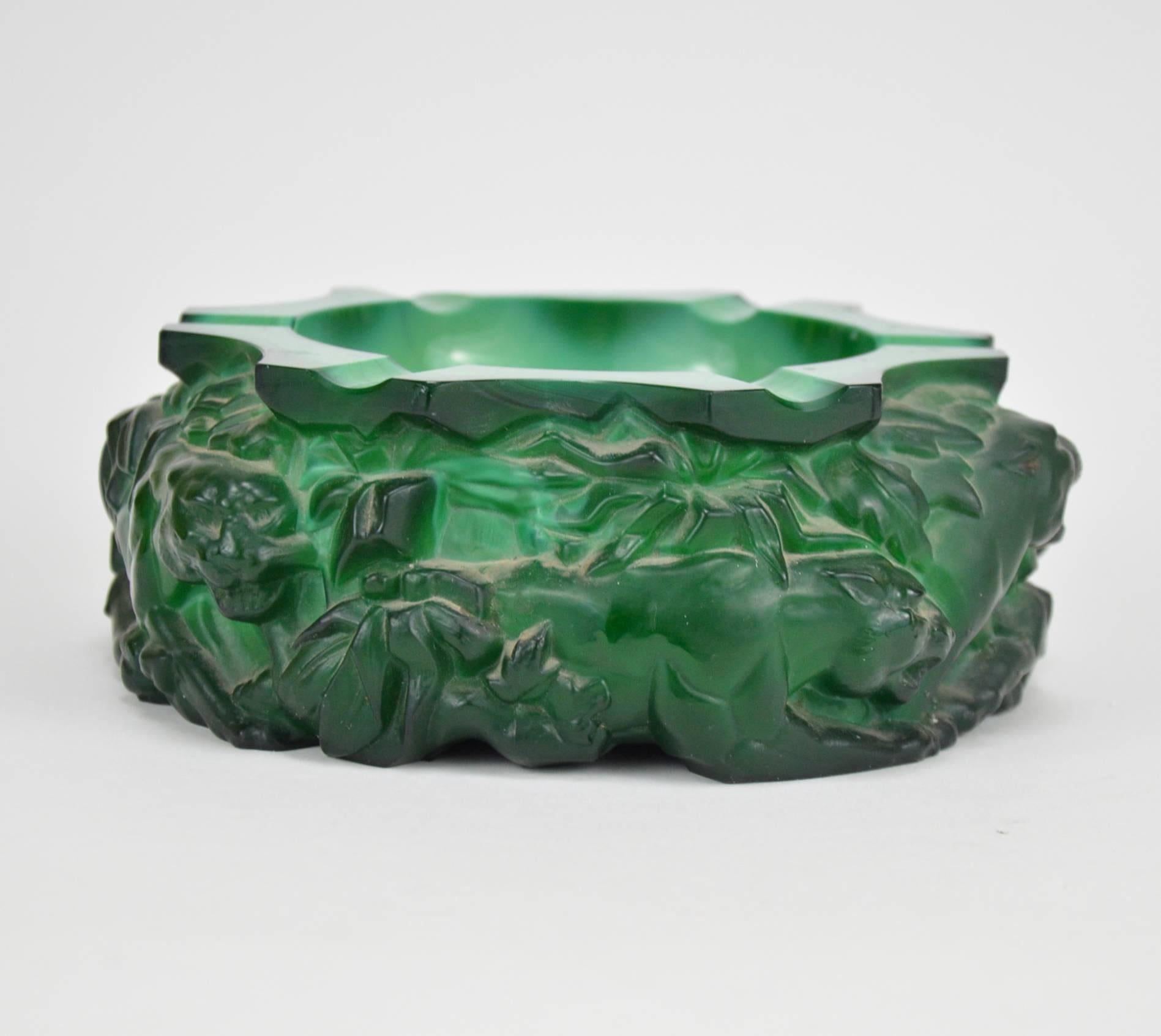 Art Deco green malachite style Bohemian glass ashtray representing lion and panther.
  