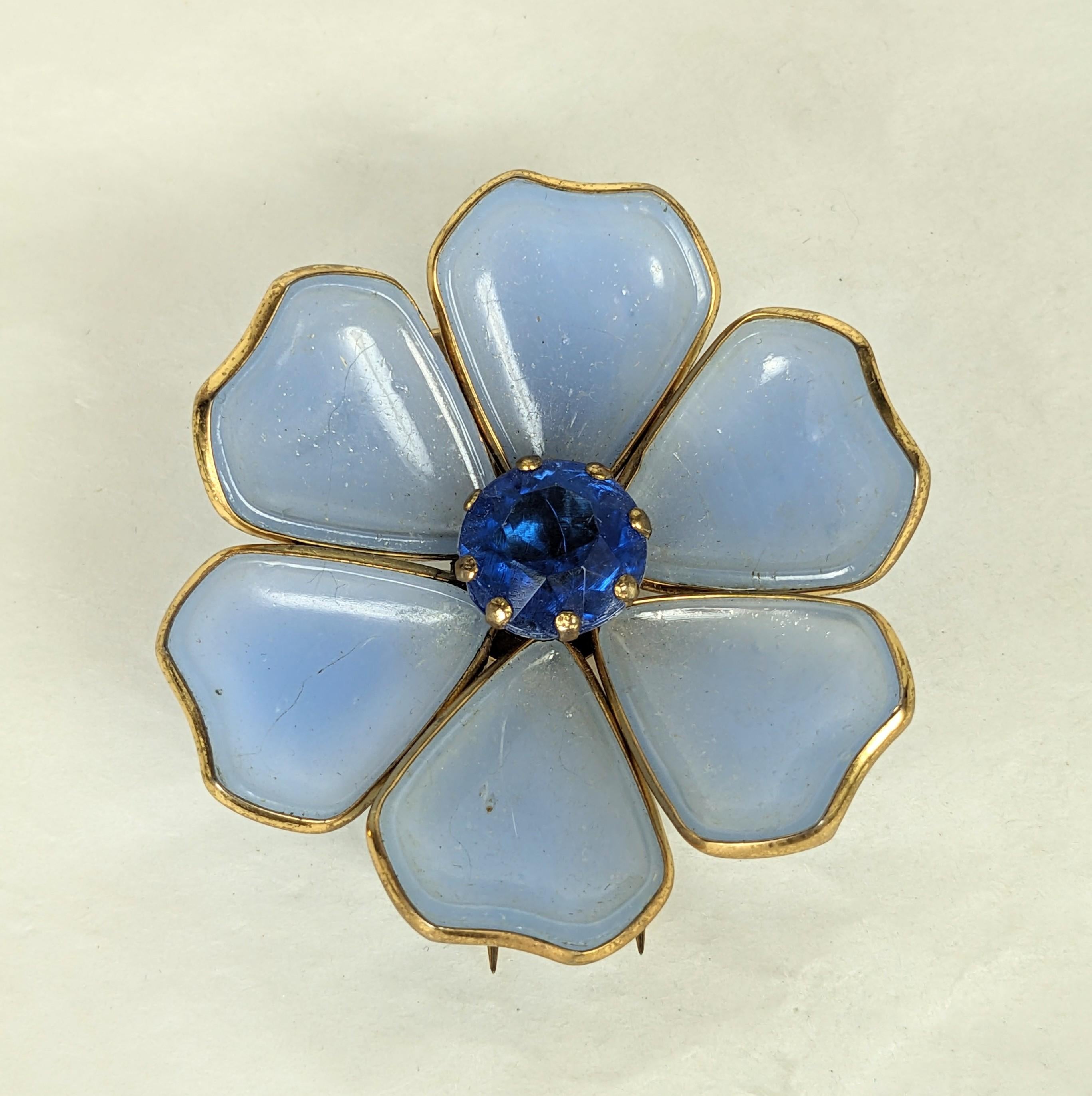 Art Deco Gripoix Style Flower Clip from the 1930's. Pale chalcedony glass are bezeled in brass with sapphire crystal center with Belperron colorations. 1930's USA. 1.75