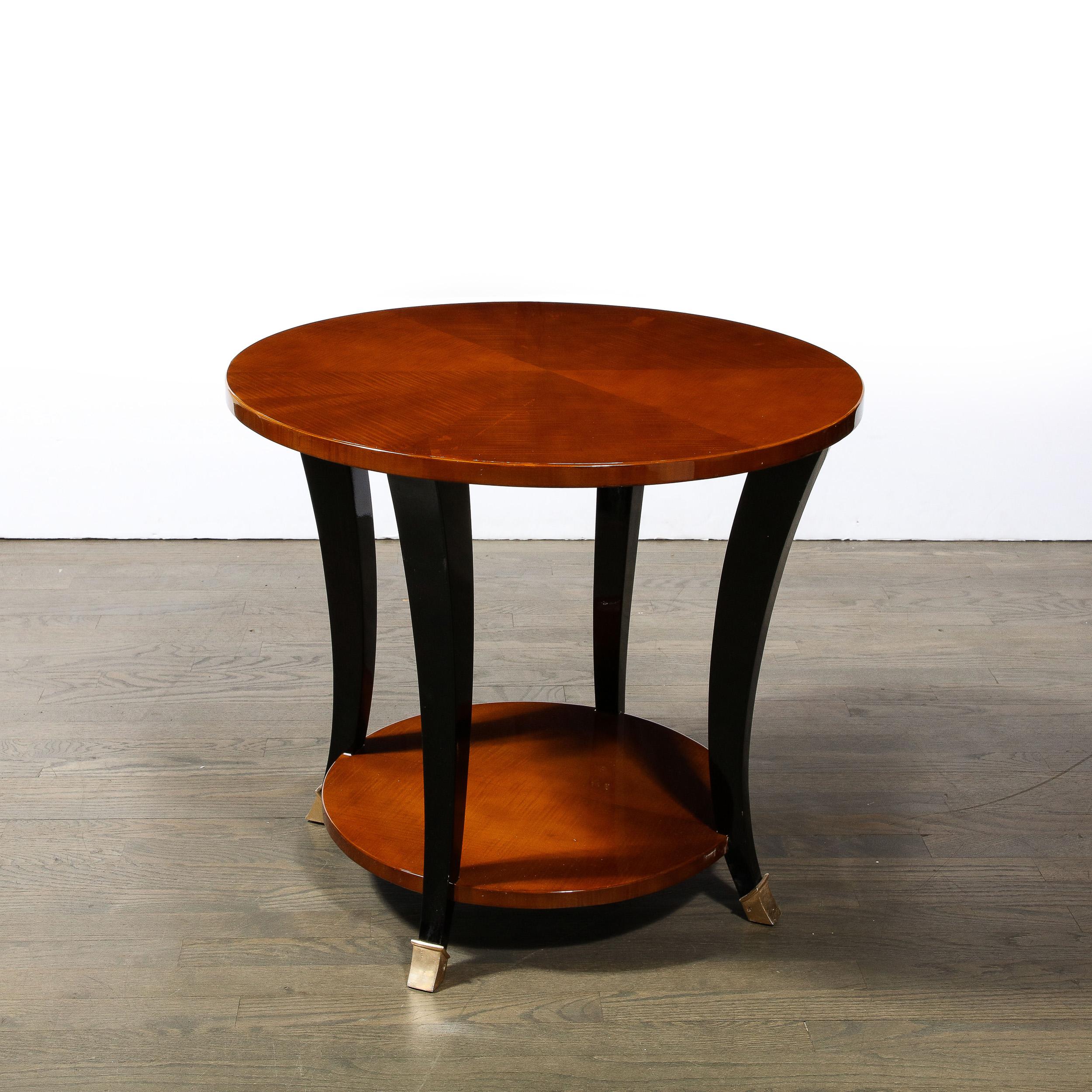 Mid-20th Century Art Deco Gueridon Table in Bookmatched Walnut W/ Ebonized Legs & Brass Sabots For Sale