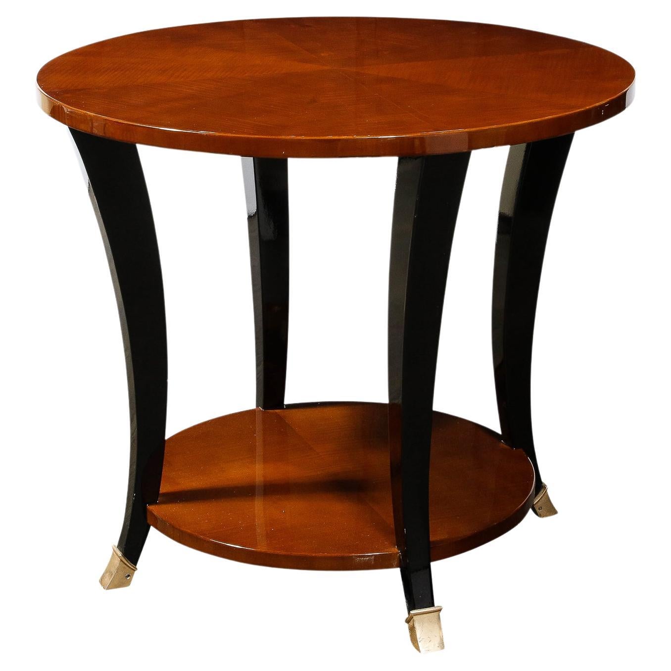 Art Deco Gueridon Table in Bookmatched Walnut W/ Ebonized Legs & Brass Sabots For Sale