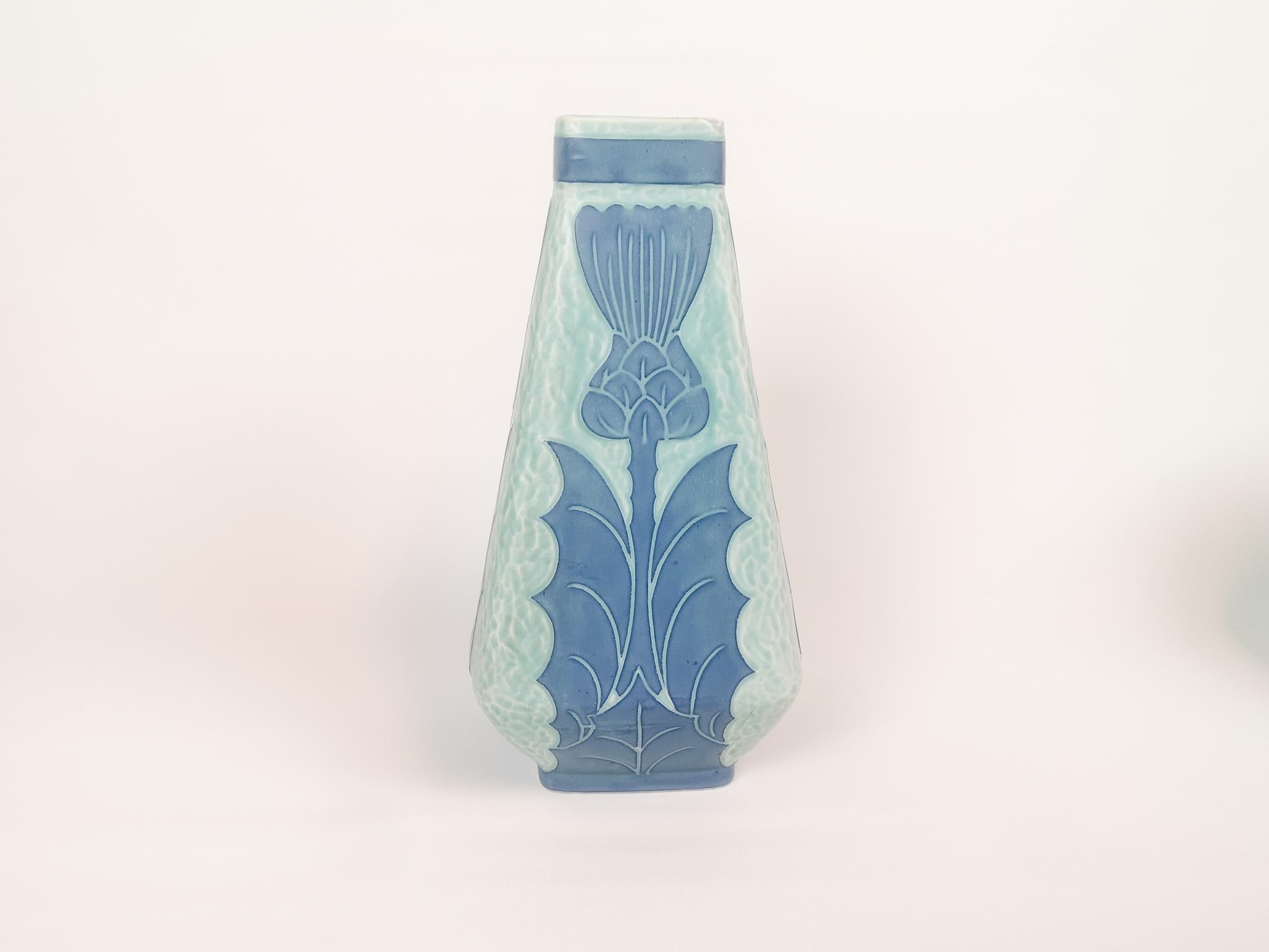 Art Deco Sgraffito vase decorated with a floral motif, by Josef Ekberg for Gustavsberg.
Sgraffito is a way of combining two layers into a pattern, the second layer is scraped of and left is a light blue background with a beautiful pattern on