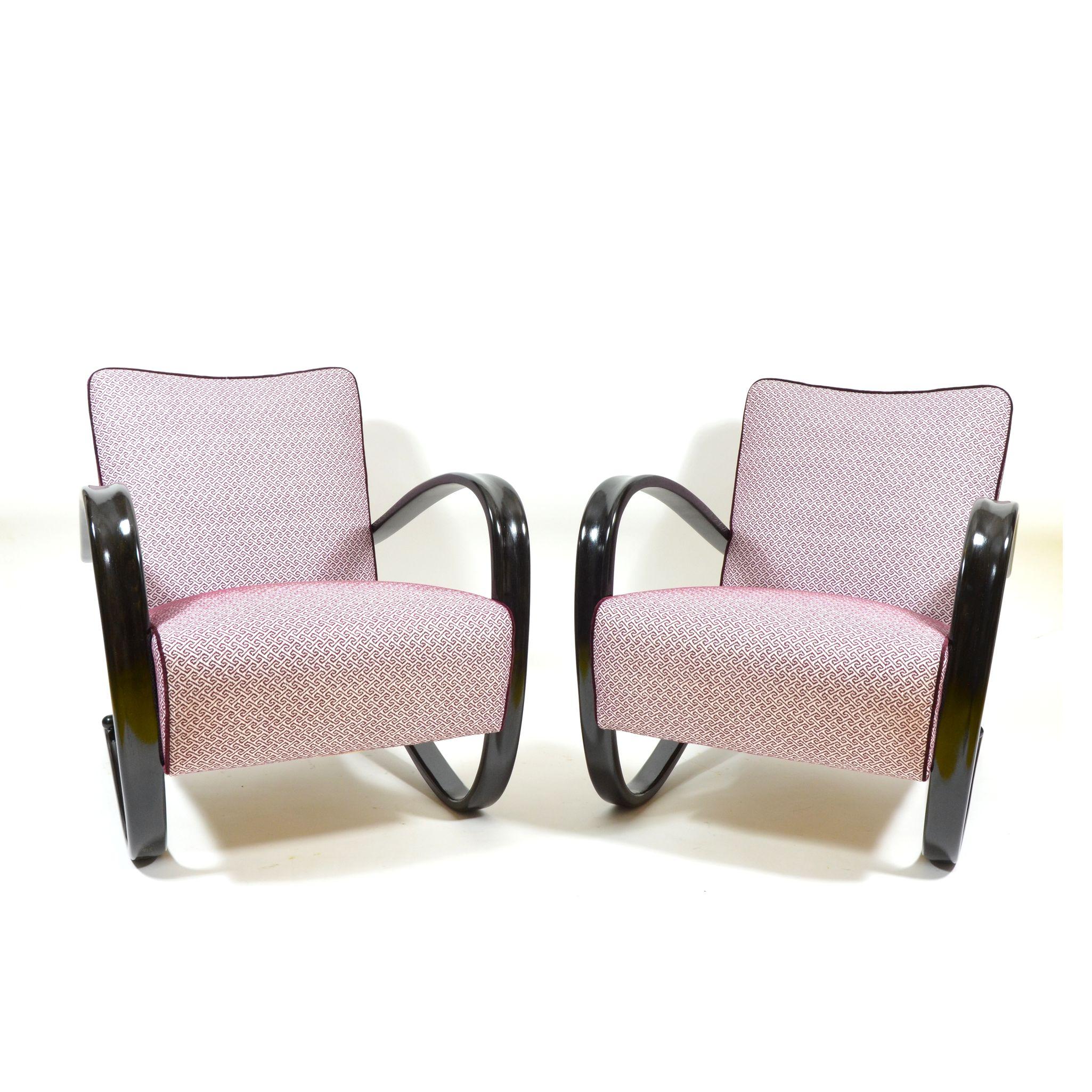 A pair of completely restored armchairs designed in the 1930s by famous Czechoslovak architect Jindrich Halabala. Armchairs were produced in former Czechoslovakia during 1930s-1950s by Thonet. Armchairs have new upholstery fabric and completely