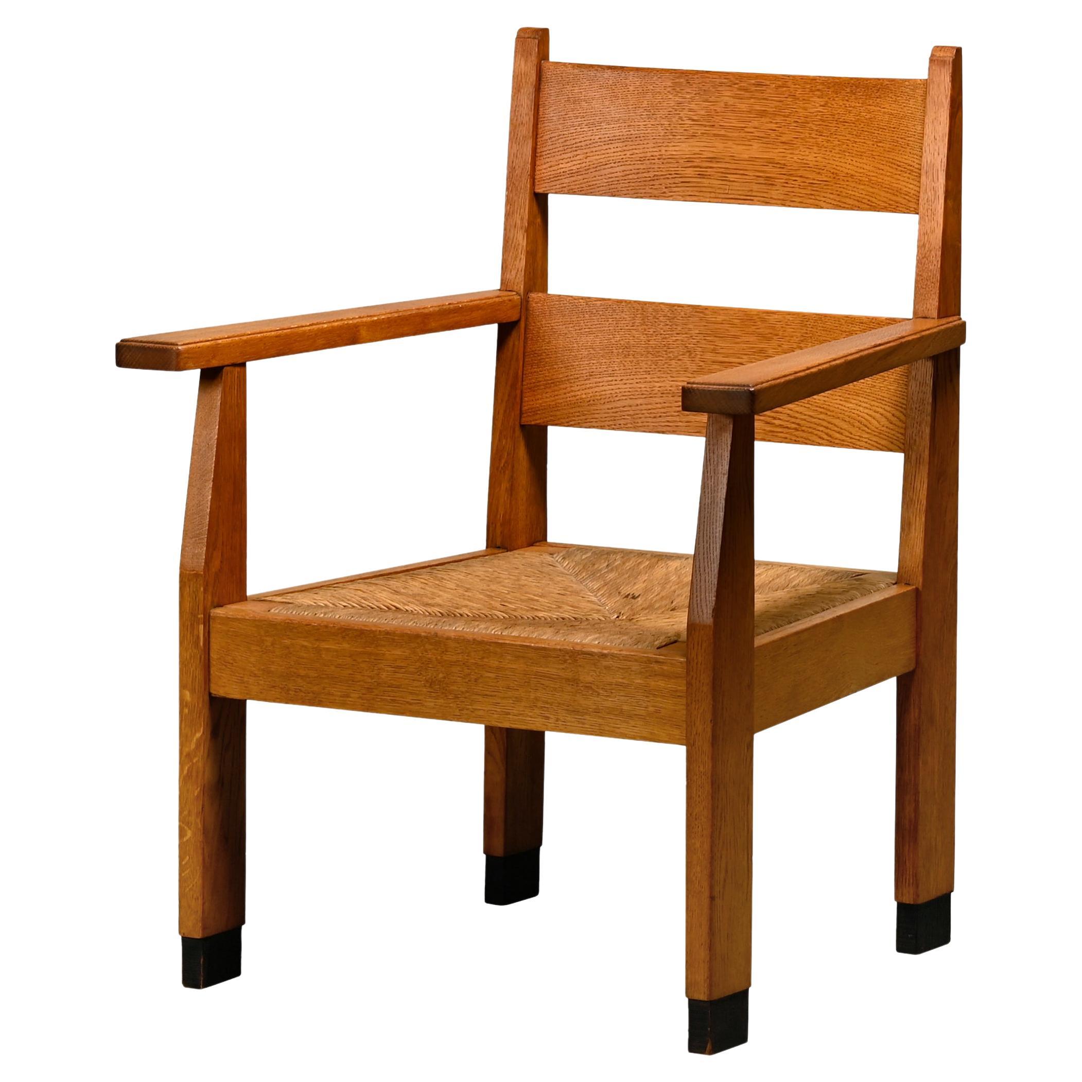 Dutch Art Deco The Hague School Armchair in solid Oak and Straw, 1930s For Sale