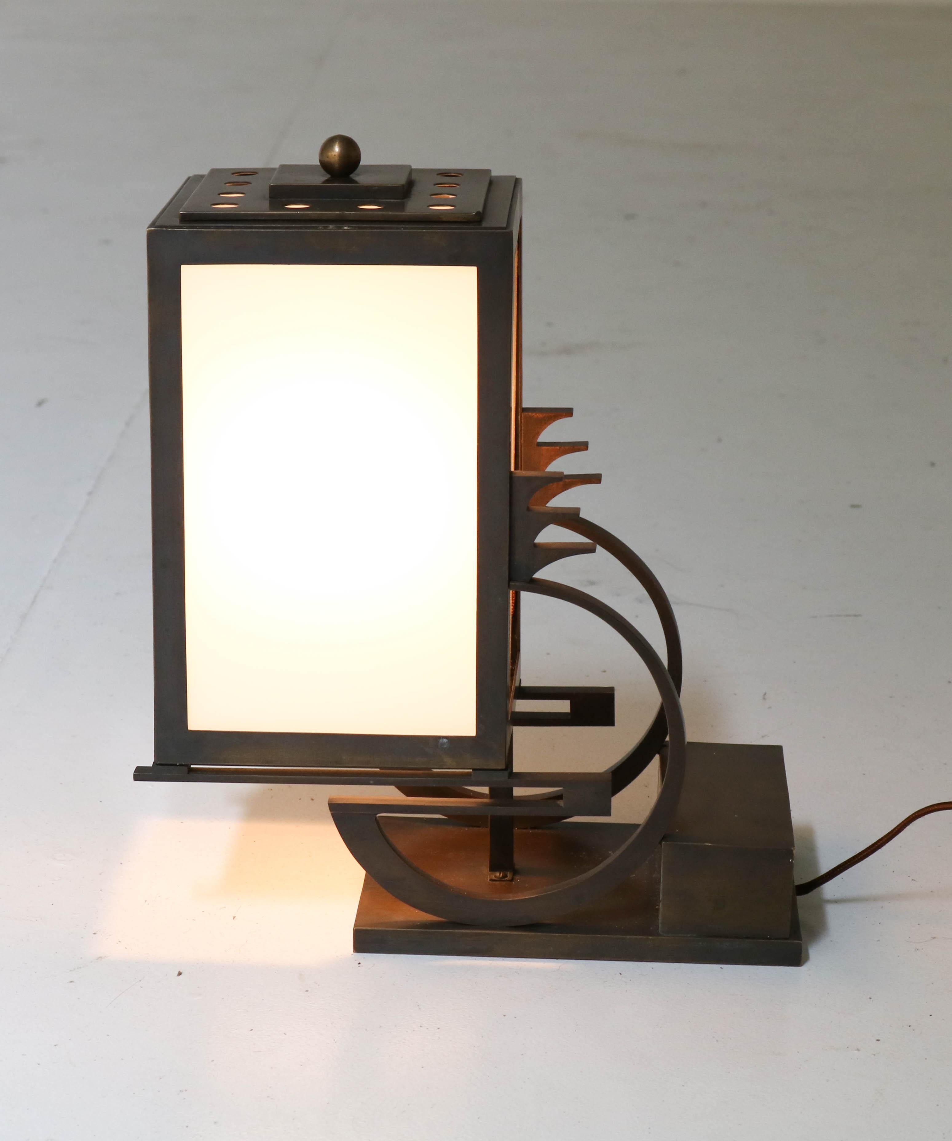 Magnificent and very rare Art Deco Haagse School table lamp.
Attributed to C.J. (Karl) Gellings, a famous designer of bronze Art Deco clocks.
Striking Dutch design from the 1920s.
Bronze with original milk glass.
Rewired for daily use.
In very