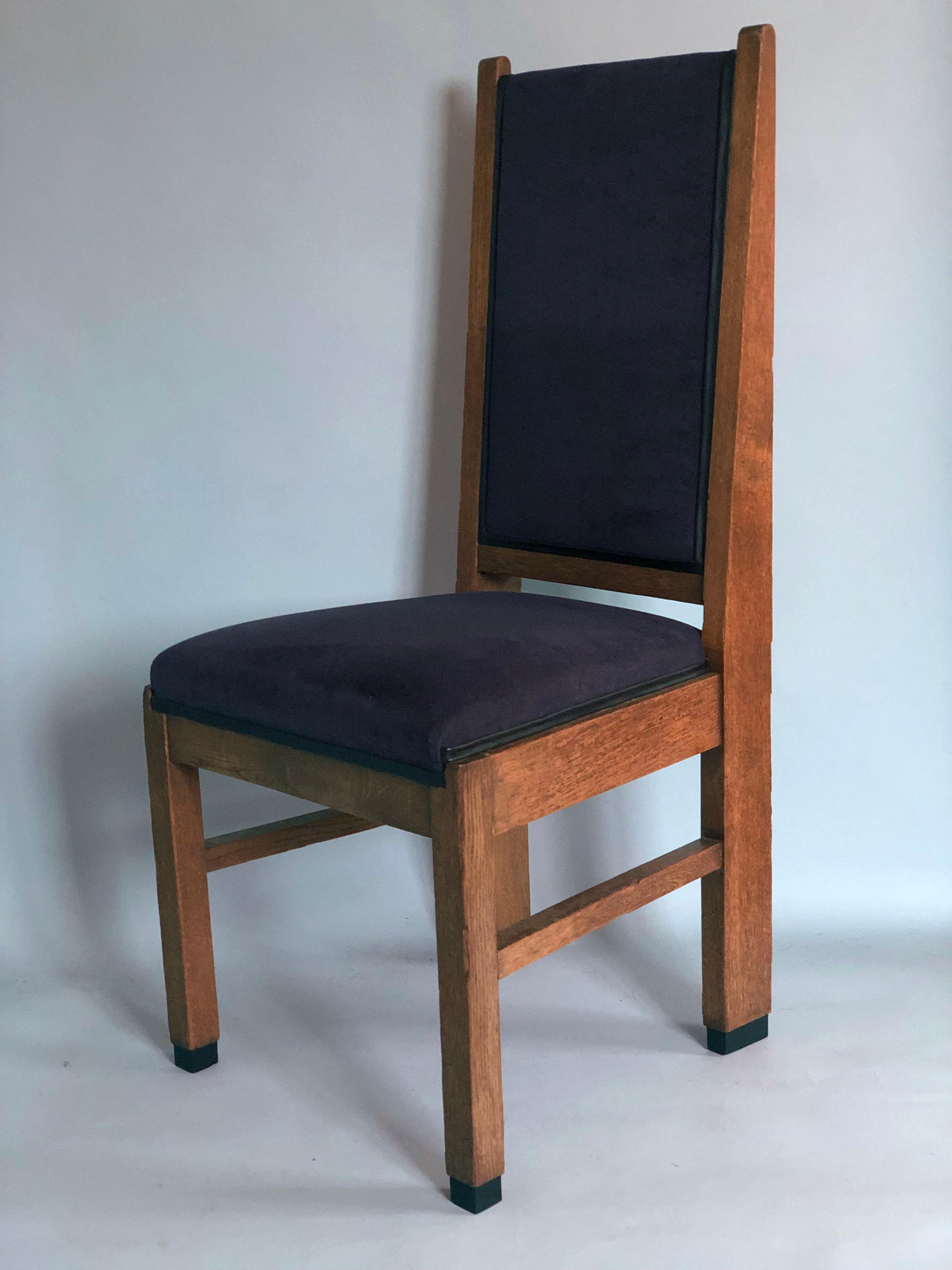 Art Deco design dining chairs from The Netherlands. Frits Spanjaard for 'The Hague School' 1930s. The 2 high-quality chairs with a high back have beautiful features, have been carved and re-waxed. The purple fabric of the seat and back is from a