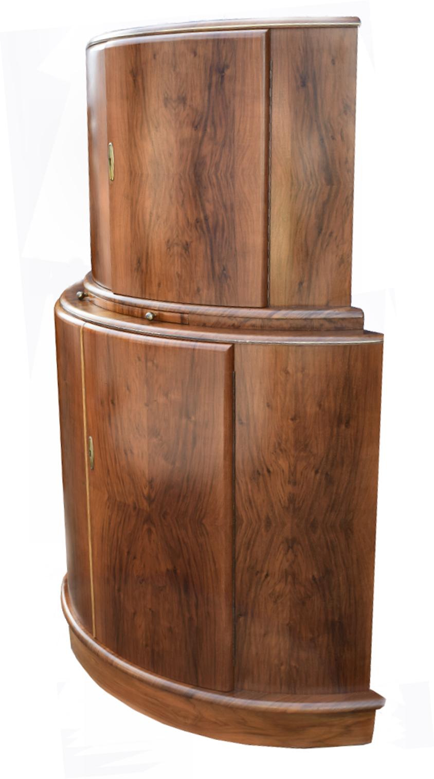 Gorgeous and original 1930s Art Deco cocktail cabinet in figured walnut. Originating from England and dating to the 1930s and made by a company called 'Rivington', it's original makers labels are still inside the cabinet. This cabinet really is