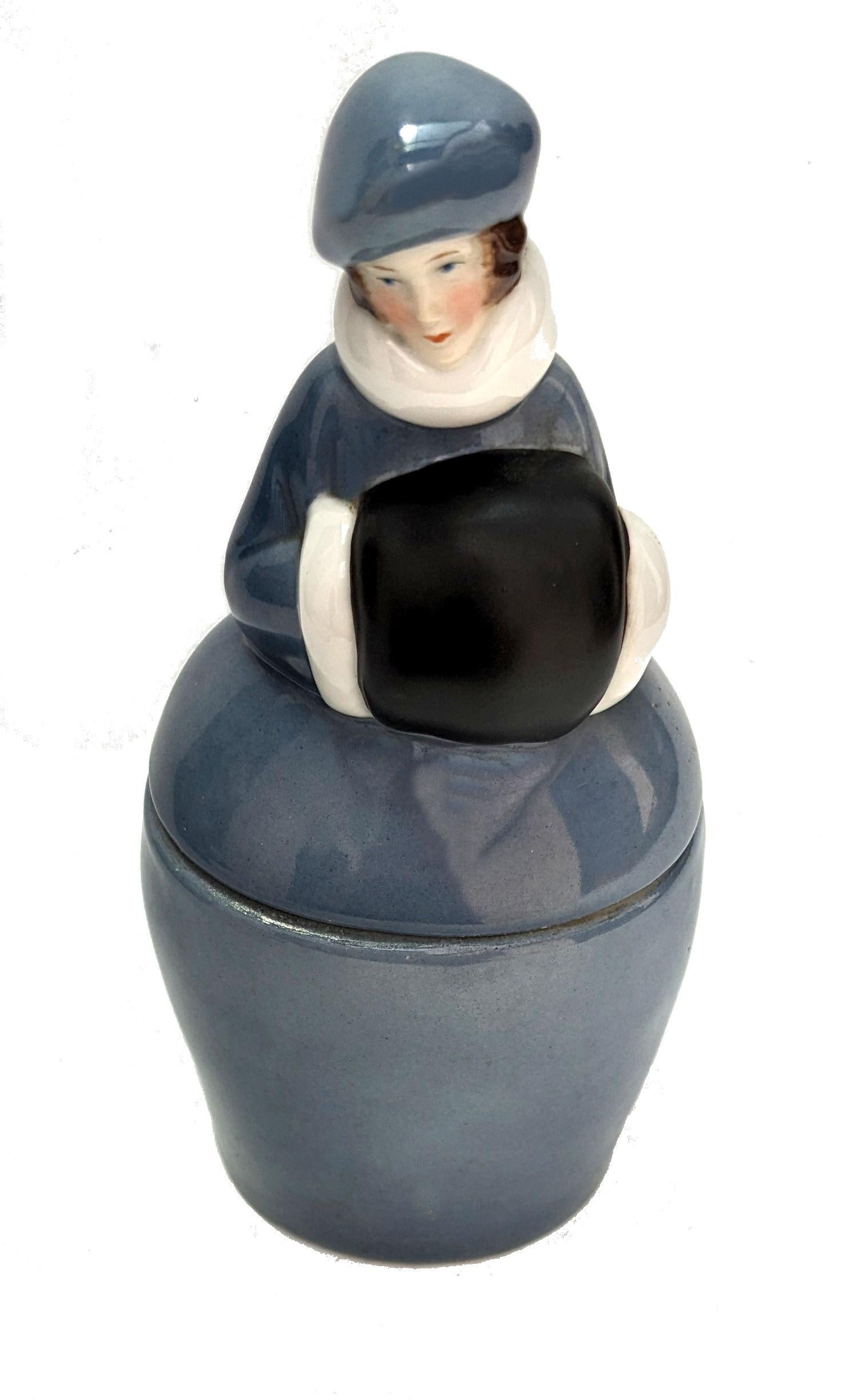 For your consideration is this very attractive and totally original 1930s Art deco ladies powder/ trinket box. The top half of the container is in the form of a 1930's flapper girl with her crimped bob haircut and delicately and expertly painted