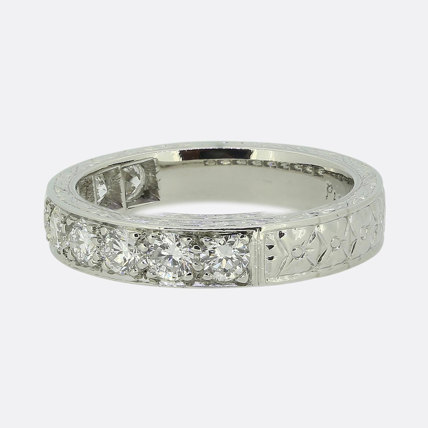Here we have a gorgeous half-eternity diamond ring taken from a time when the Art Deco style was continuing to revolutionise the world of design. This highly detailed piece has been crafted from platinum and features 9 individually claw set round