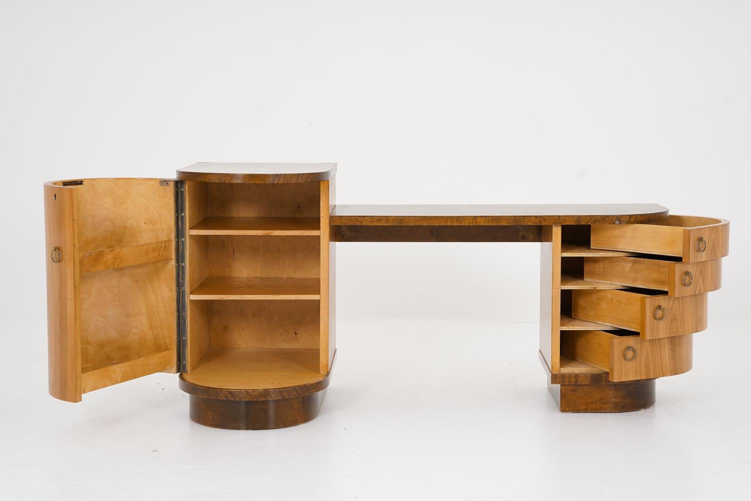 Beautiful hallway console by Axel Larsson for Bodafors, Sweden.
This console offers one locker and four drawers that elegantly opens sideways. The cabinet is made of elm with details and table tops in birch.

Condition: Good restored condition with