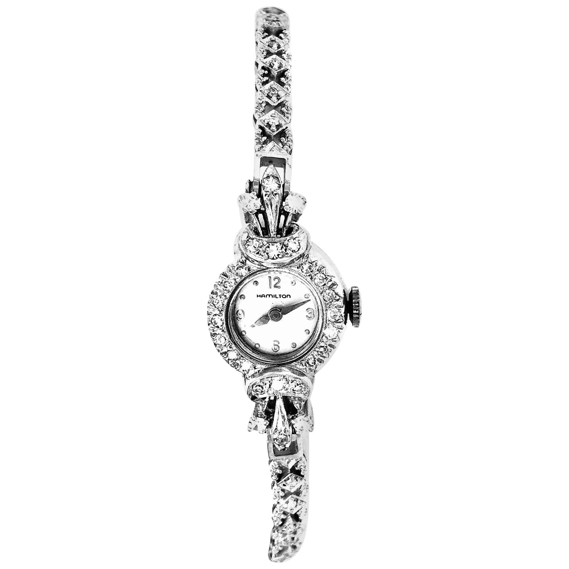 Hamilton 14 Karat Ladies Watch 52 Total Diamonds 17.85 grams 2.00 TDW.

The Hamilton Watch Company is a Swiss manufacturer of wristwatches based in Bienne, Switzerland. The Hamilton Watch Company had its genesis as an American watch design and