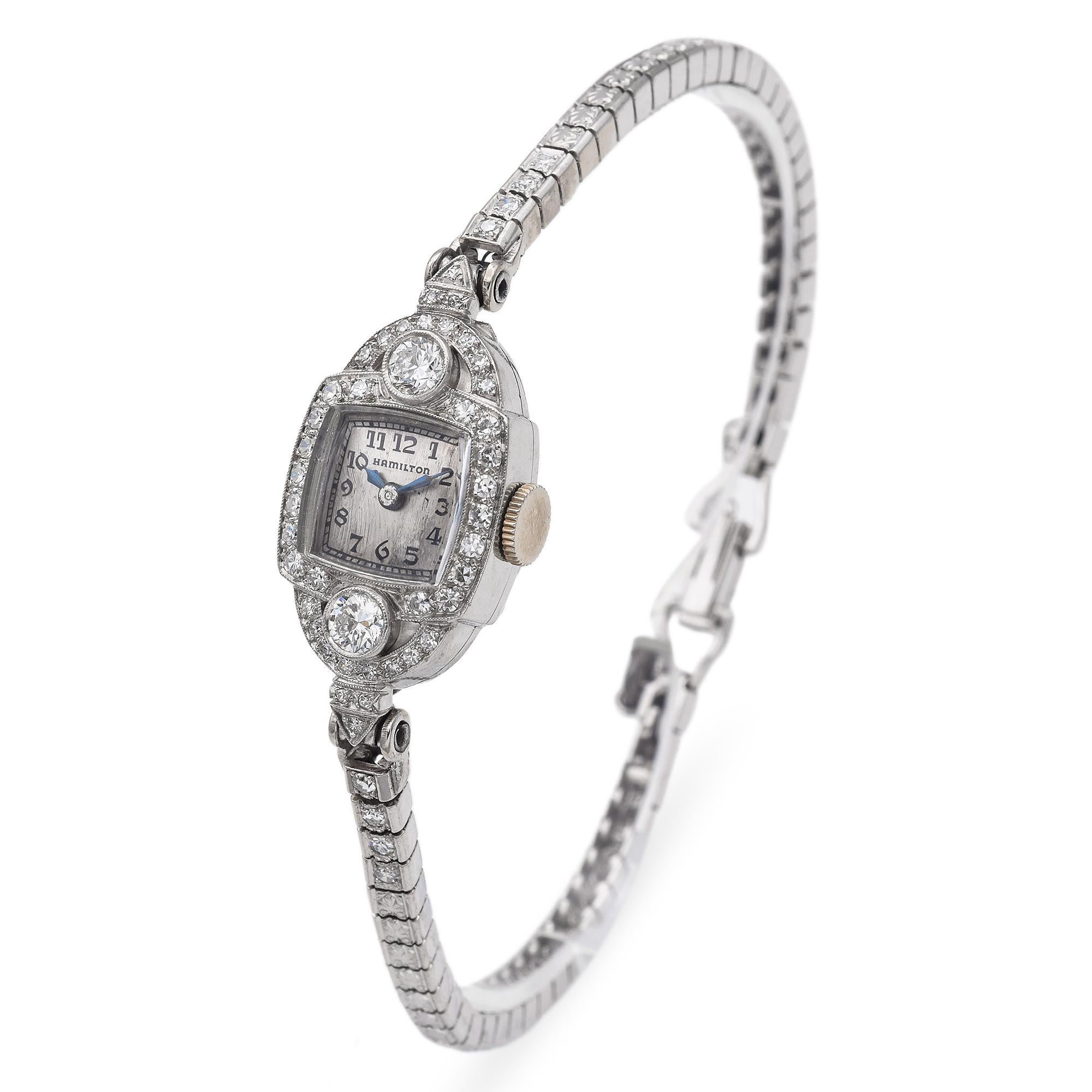 Platinum Art Deco Diamond Watch is a testament to elegance. This stunning timepiece is adorned with meticulously set diamonds, enhancing its luxurious appeal. Crafted with precision, the watch features a solid platinum case in a refined silver hue.