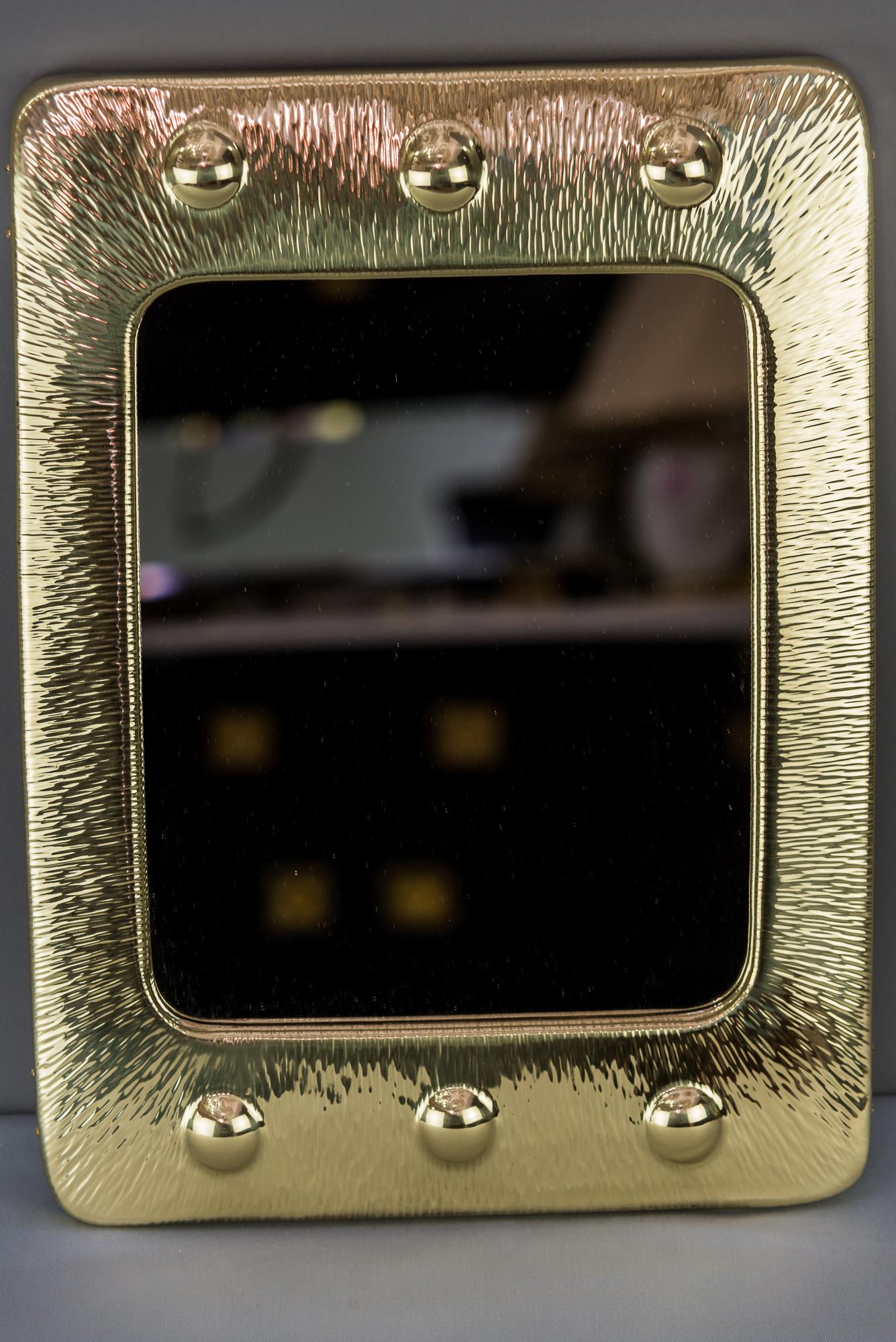 Art Deco hammered brass mirror, Vienna, 1920s
Polished brass and stove enameled.