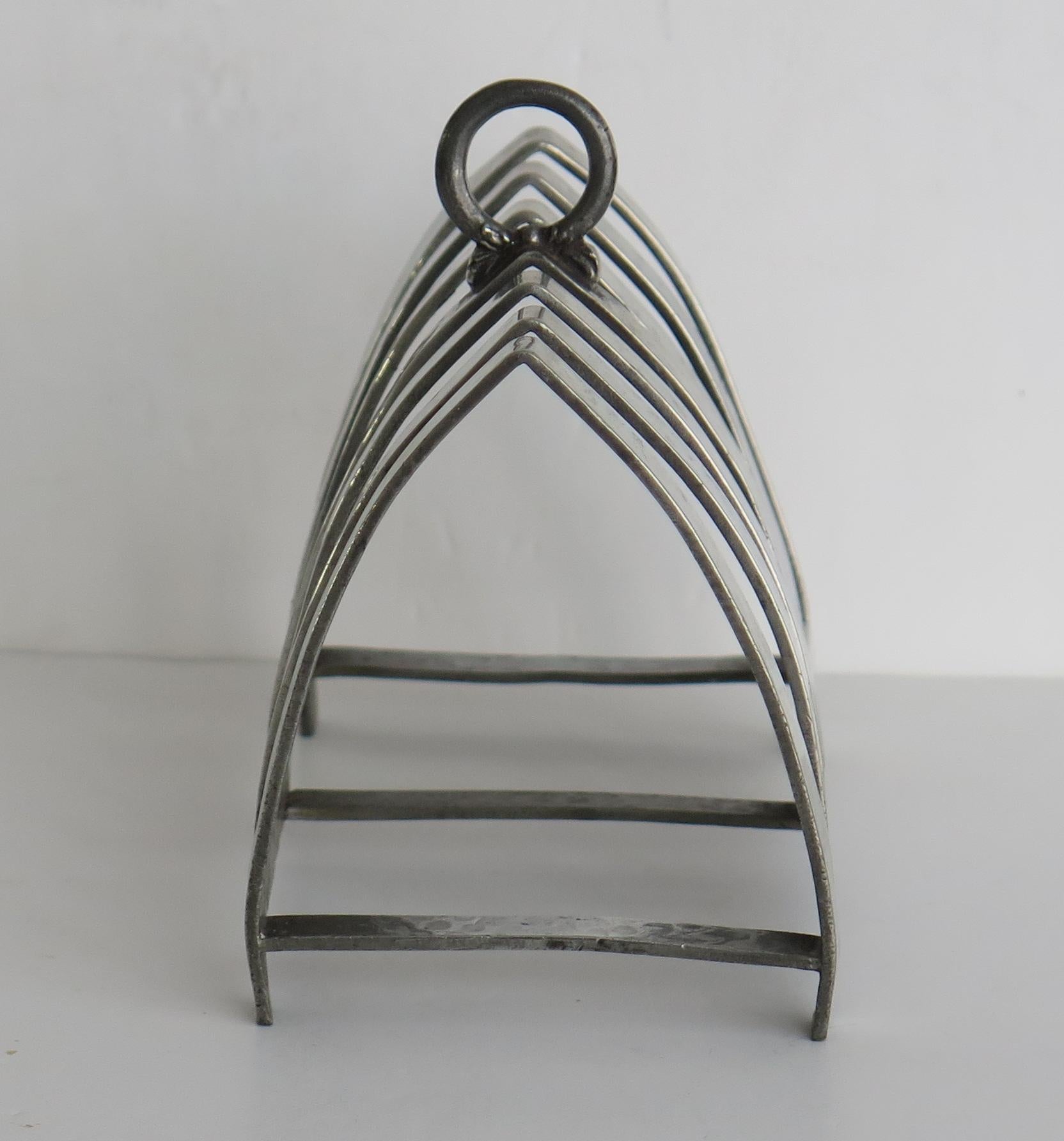 This is a good hand made, hammered pewter Toast rack made by Connells of 88 Cheapside, London, during the Art Deco period, Circa 1925

The shape is very 