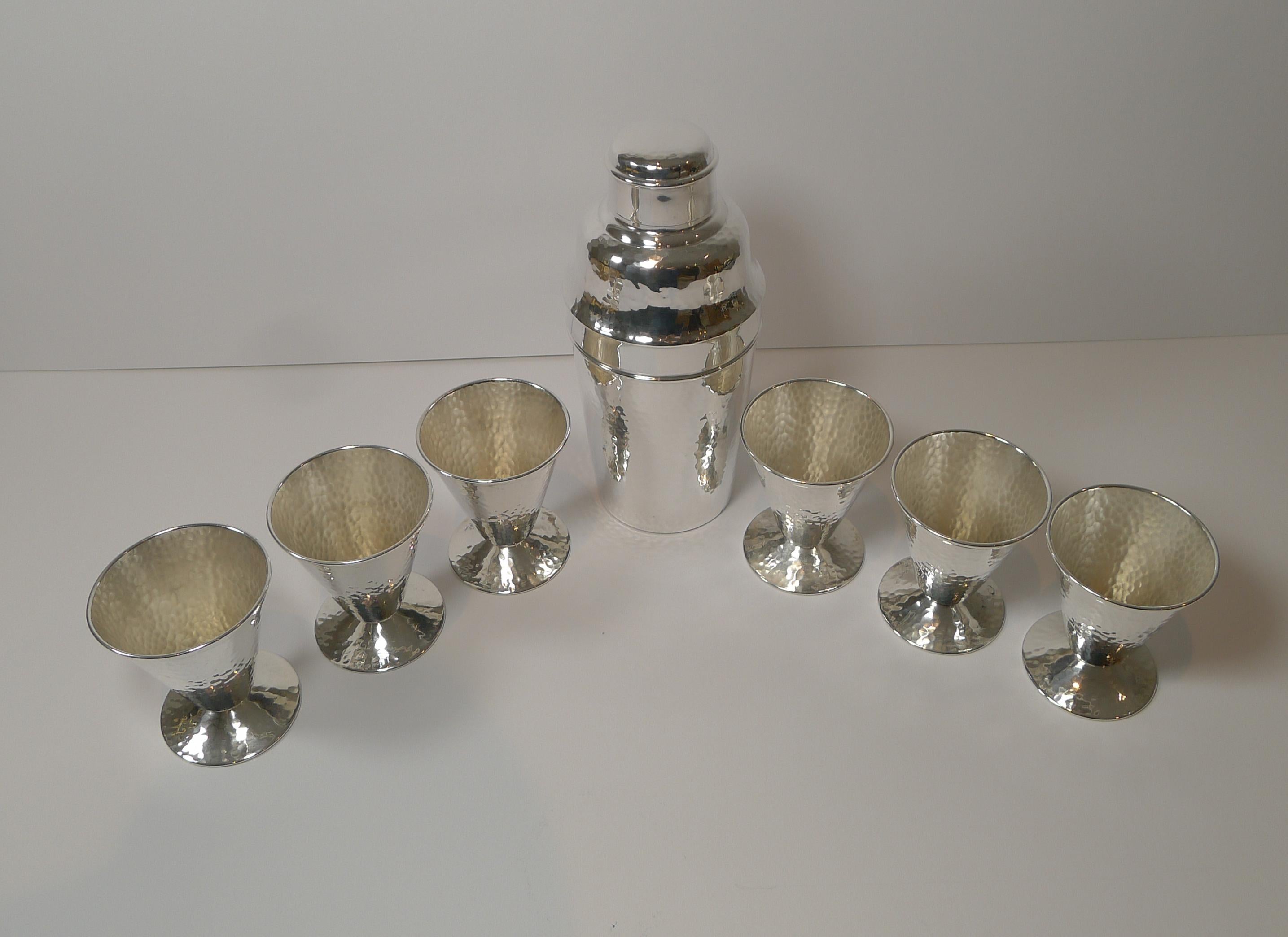 A magnificent cocktail set which came to us as a set but started life on two different sides of the Atlantic; New York meets London!

The cocktail shaker was made by the top-notch silversmith, Mappin and Webb of London and the conical shaped