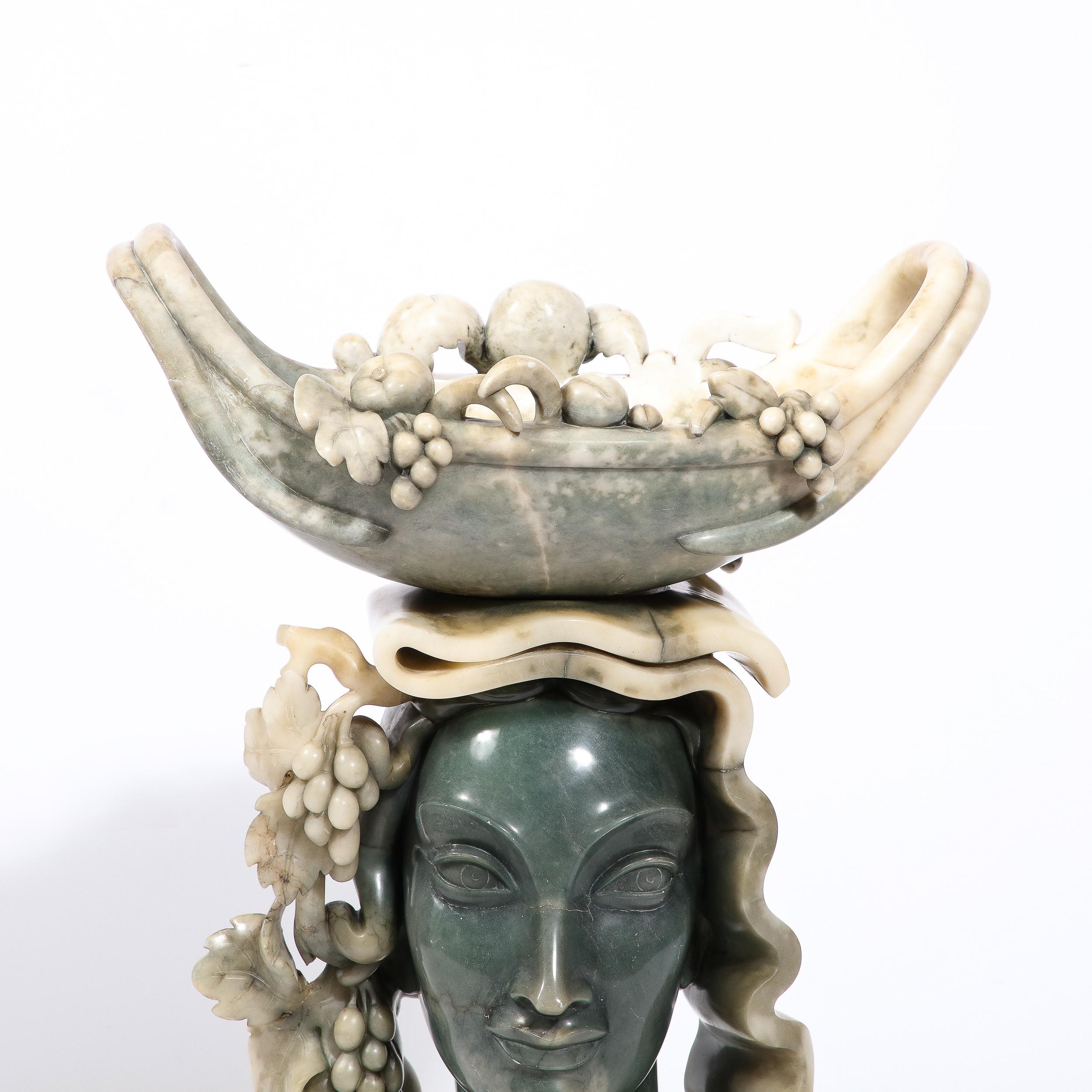 This magnificent Art Deco figurative sculpture was realized in Italy, circa 1948. Carved in sumptuous green alabaster the bust offers a stylized depiction of a woman with Modigliani- esque eyes and refined, balanced features of classical greek