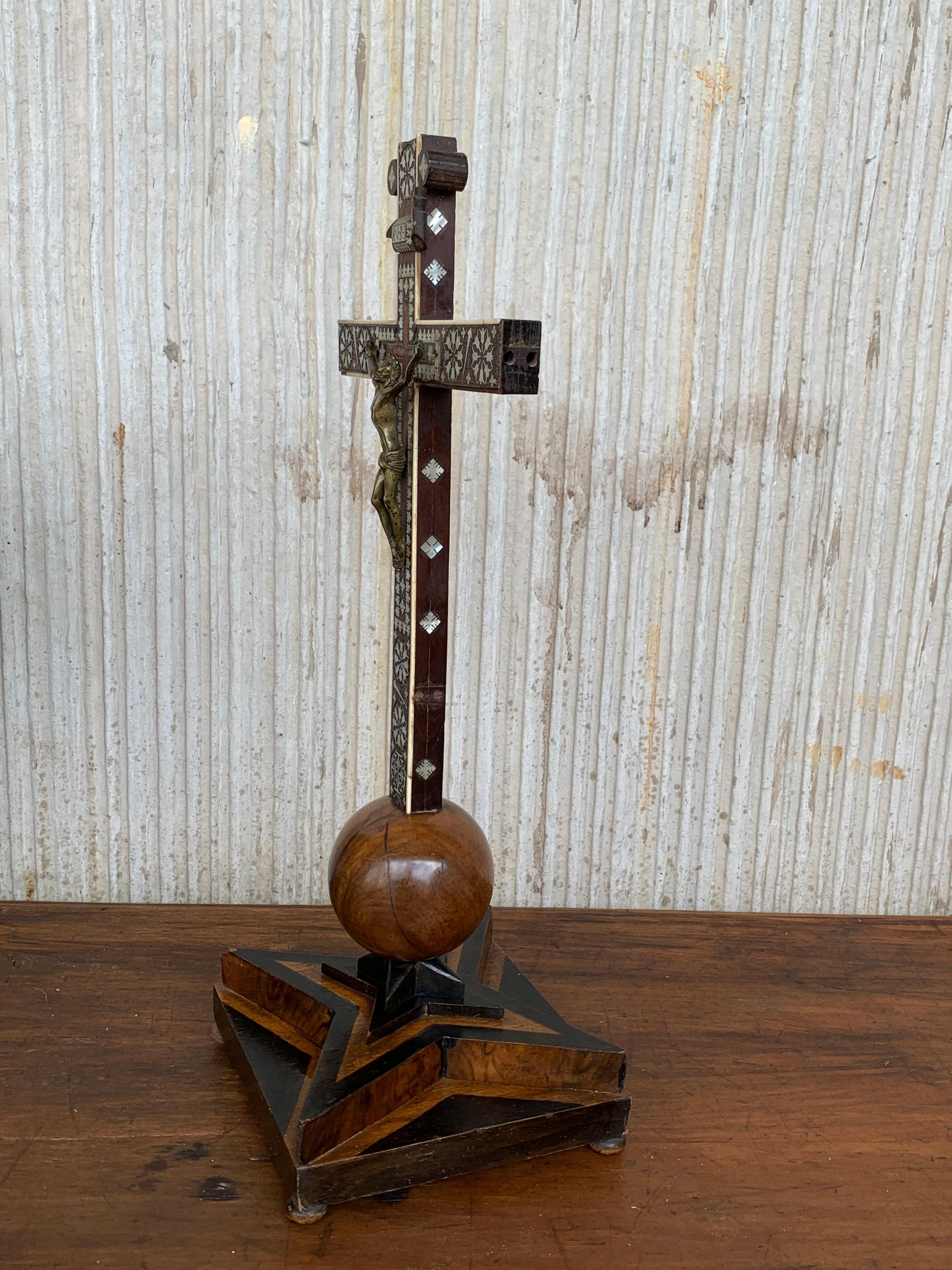 Crucifix from the mid-1800s with a carved shroud or veil depicting Christ in the base. This unique and remarkable antique crucifix can both be used as a table and as a wall crucifix. Over the decades we have sold a number of unique and very well