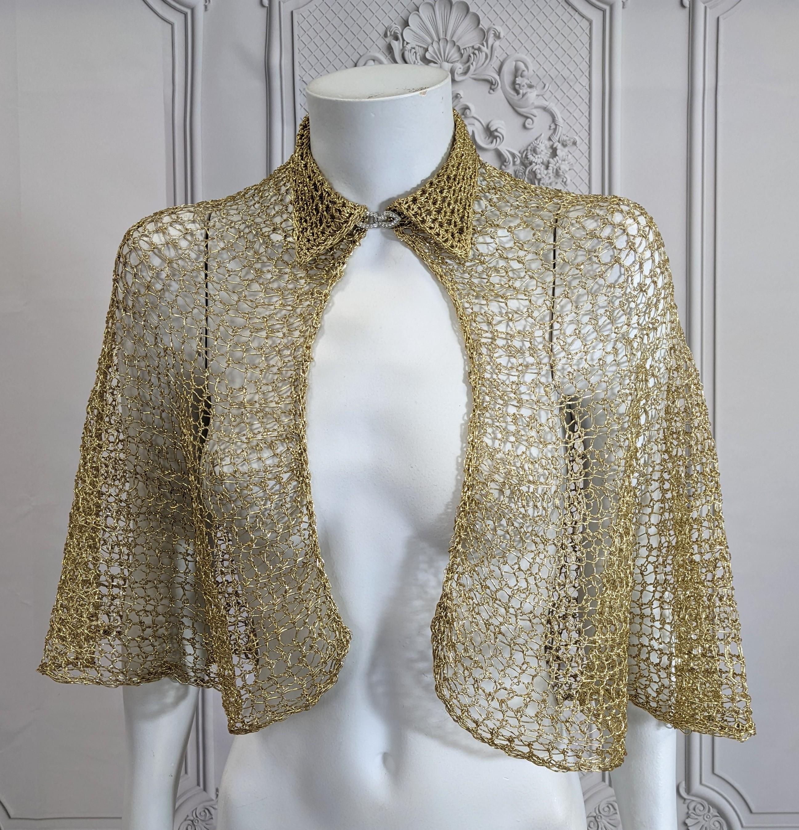 Elegant and versatile Art Deco Hand Crochet Gold Yarn Capelet from the 1930's with pave Deco clasp. Hand crochet in circular pattern in an open work web.
Small neck size, 13.00