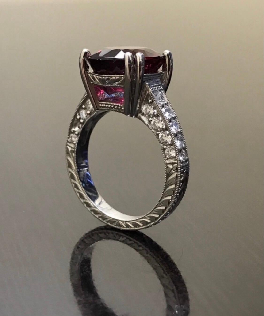 DeKara Design Collection

Metal- 90% Platinum, 10% Iridium, 12.8 Grams.

Stones- 1 Oval Shaped Rubelite 6.70 Carats, 26 Round Diamonds G Color VS1 Clarity, 1.10 Carats.

A big and heavy but extremely beautiful Art Deco influenced 6.70 Rubelite