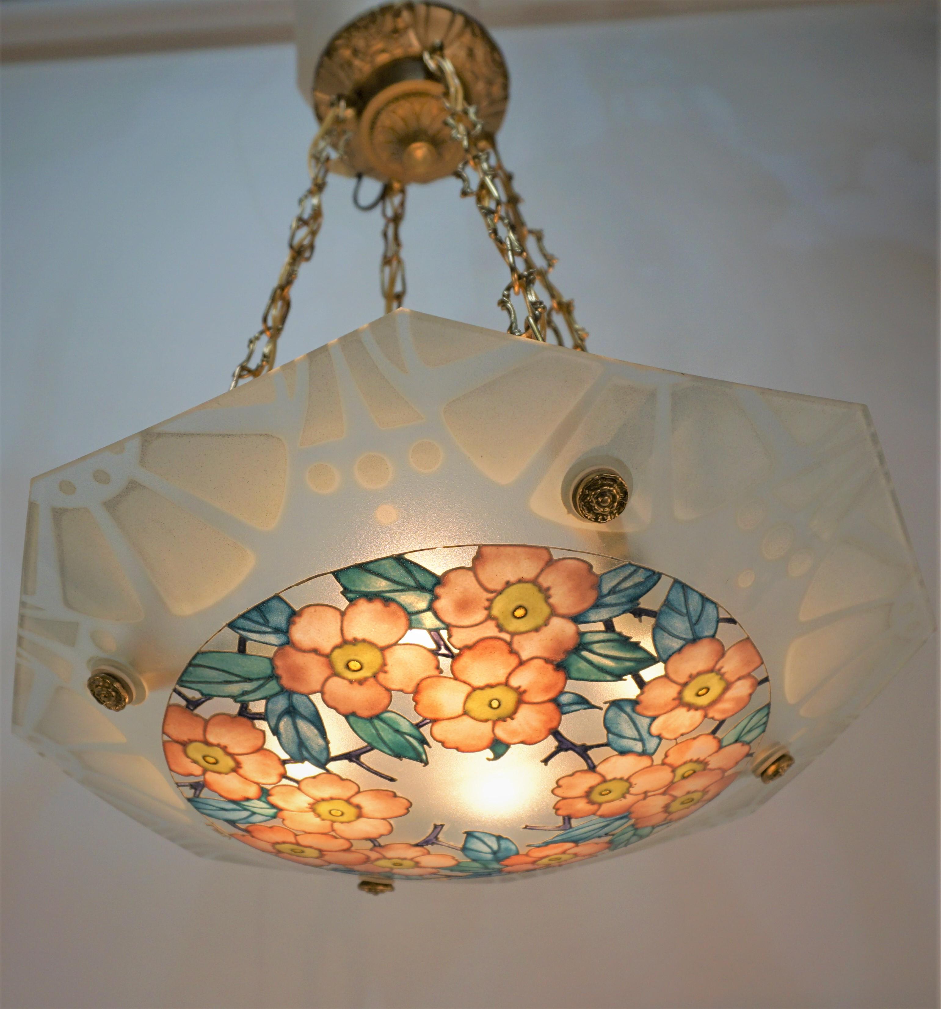 This beautifully hand painted glass chandelier with bronze fitting. The design is flora in pink, yellow, blue and green.  Professionally rewired with four lights and ready for installation.
Height can be adjusted by removing some of the chain.
