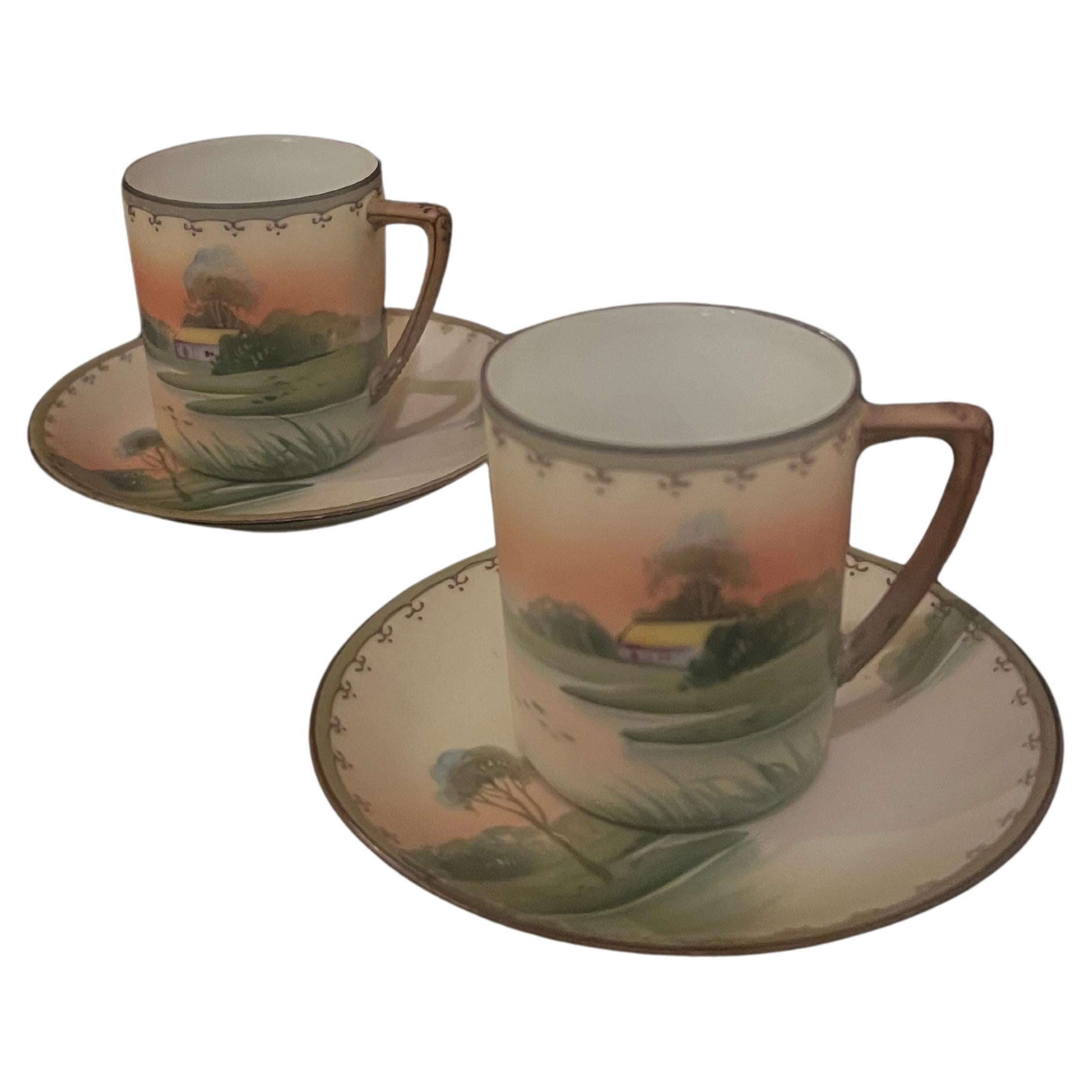 

**Pair of Rare Antique Nippon Porcelain Hand-Painted Art Deco Tea Cups, Circa 1920**

Presenting a highly collectible pair of antique porcelain tea cups and saucers, exquisitely crafted by the esteemed Nippon factory of Japan around 1920. These