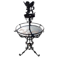 Used Art Deco Hand Wrought Large Two Tier Plant Stand with Ornamental pieces.