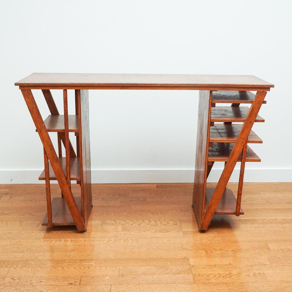 This charming Art Deco wooden desk features clean lines and open shelving. Handmade by a craftsman, keeping in theme with artsy and elegant deco vibes. 