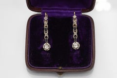 Art Deco hanging gold earrings with diamonds and sapphires