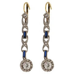 Art Deco hanging gold earrings with diamonds and sapphires