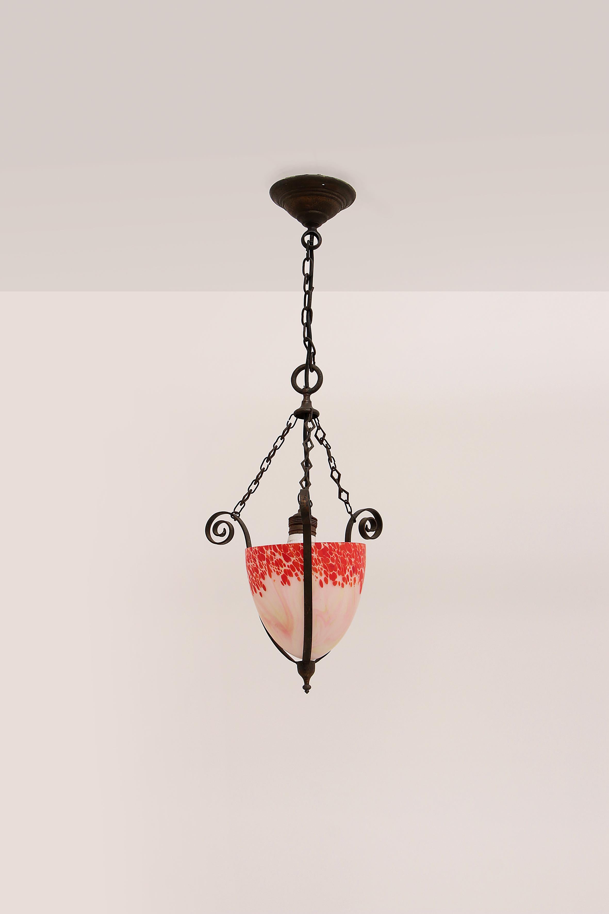 This beautiful Art Deco chandelier has amazing colors and beautiful brass details.
This very rich hanging chandelier from the French Art Nouveau period has amazing color gradations in the shade. When this lamp is lit, this is accentuated even more