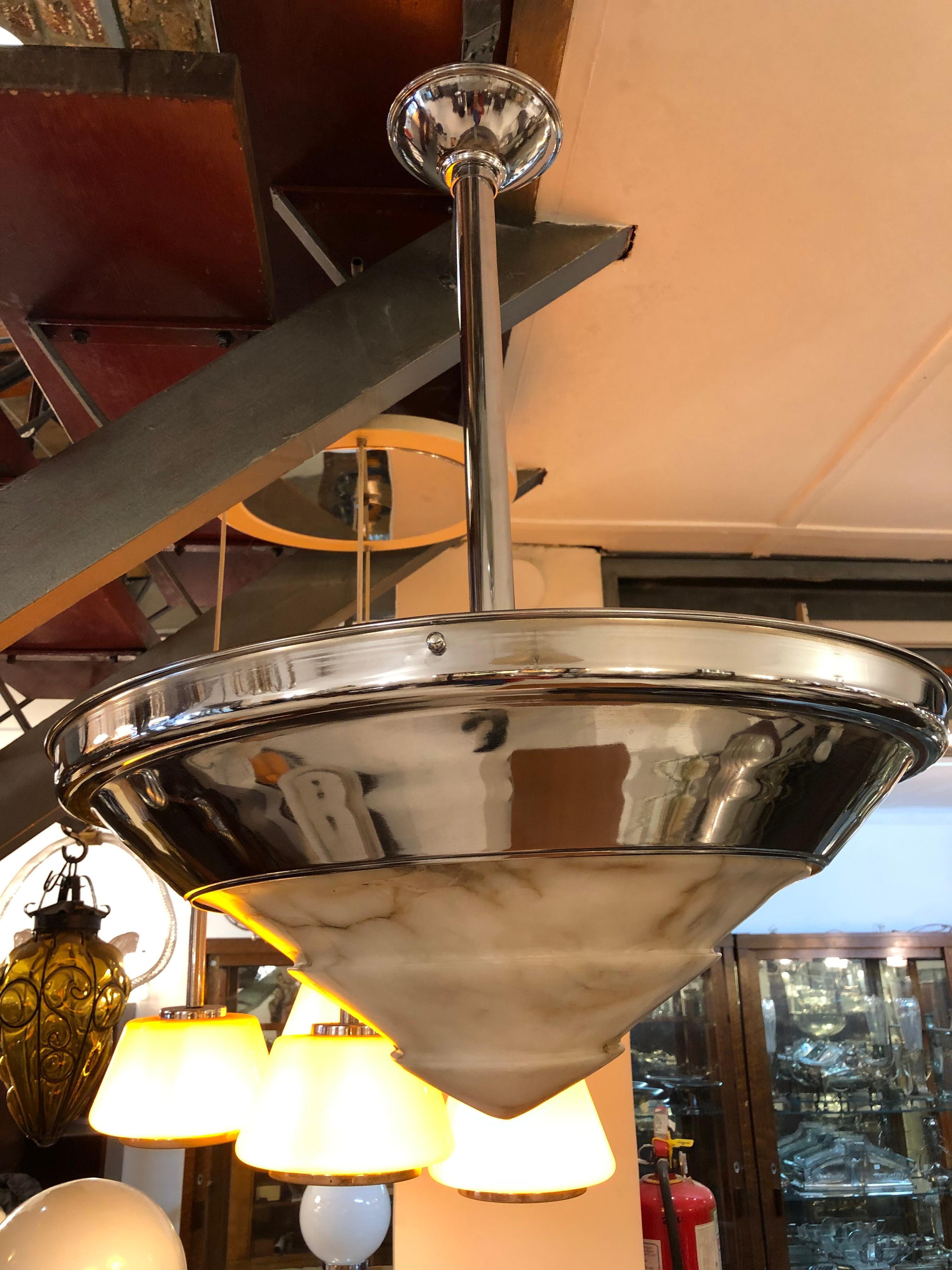 Hanging lamp.

Material: Chrome and alabaster
Style: Art Deco
Country:German
To take care of your property and the lives of our customers, the new wiring has been done.
We have specialized in the sale of Art Deco and Art Nouveau and Vintage