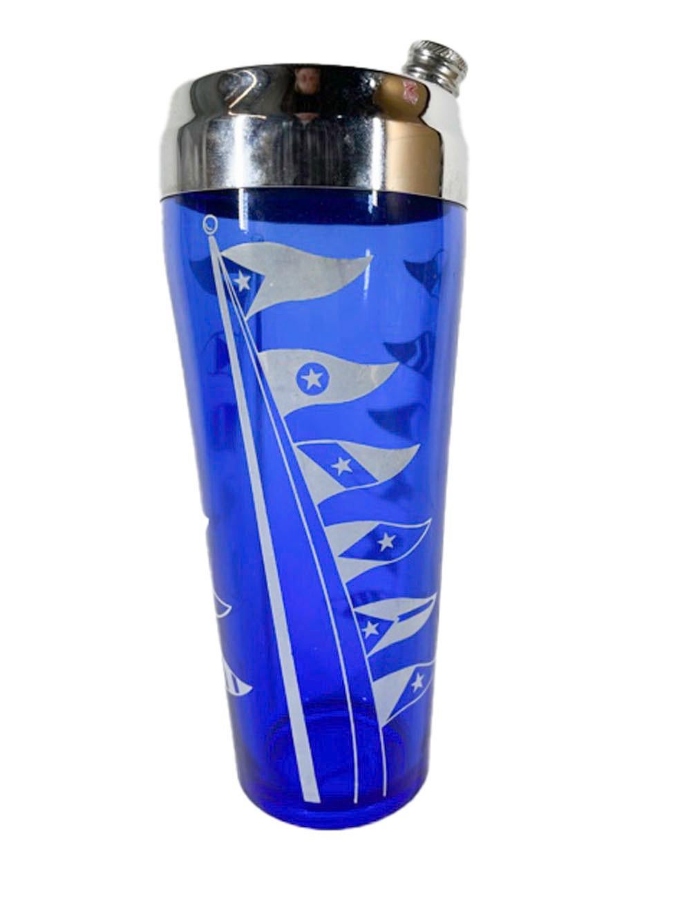 Hazel-Atlas cocktail shaker from the Sportsmans Series in cobalt glass with white nautical flags and a chrome lid.