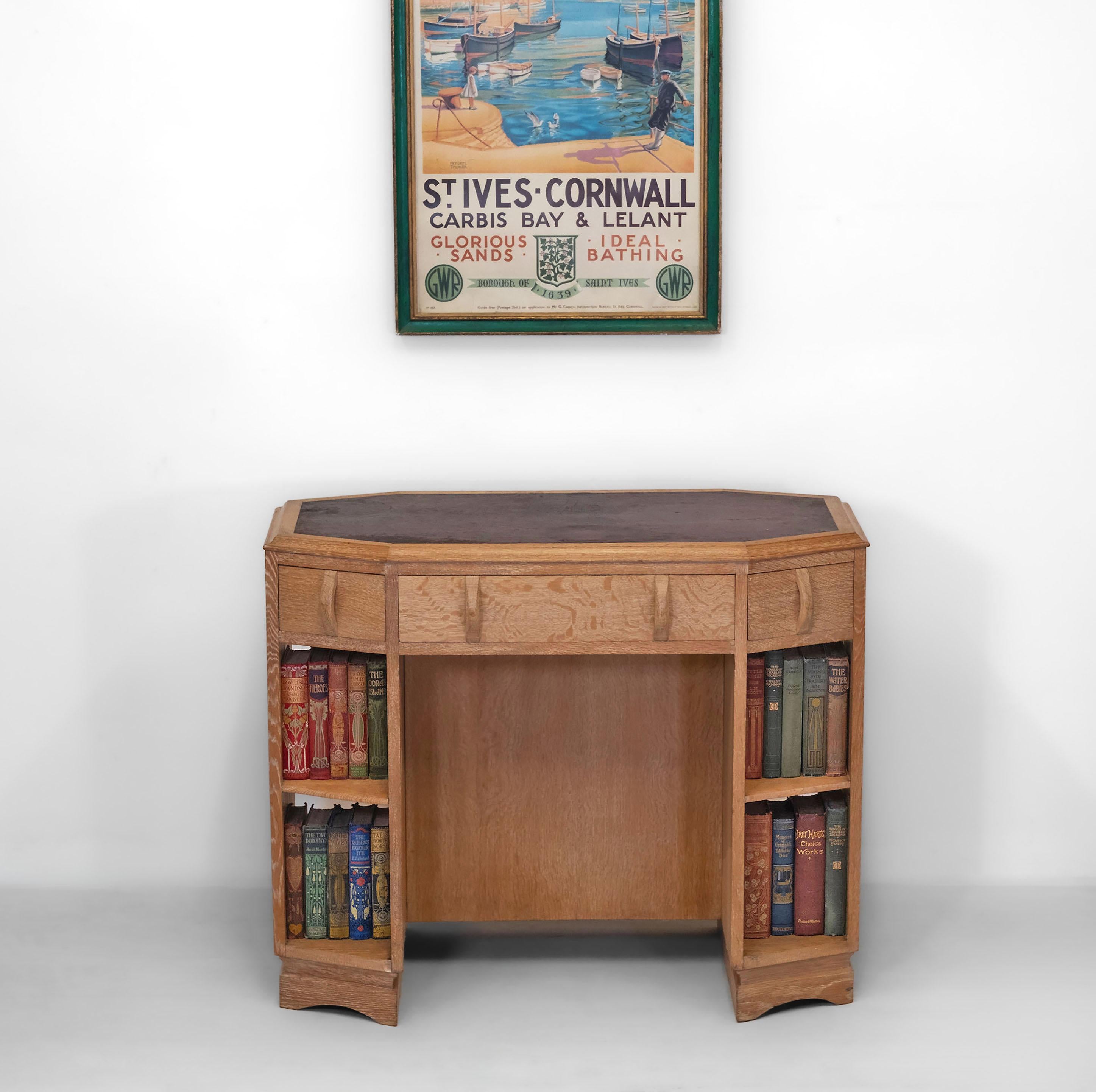 Art Deco Heal's octagonal limed oak writing desk/double sided open bookcase with leather inset top. Labelled. Circa 1930.

The desk comes with the 2006 receipt from Heal's, along with the Heal's exhibition booklet that it was featured in - 'The Arts