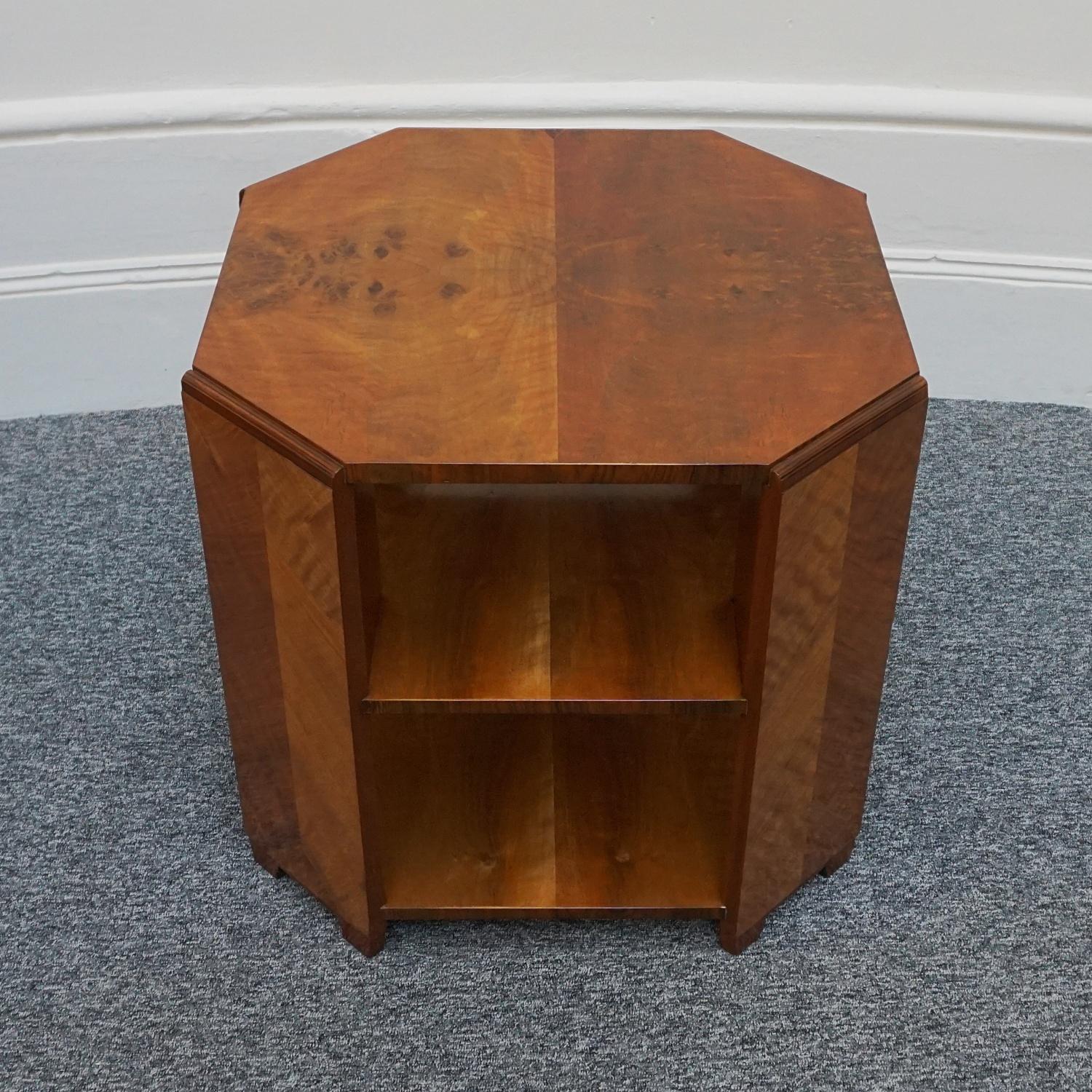 An Art Deco two tiered side table by Heal's of London. Burr and figured walnut veneer. Original Heal's stamp to underneath.

Dimensions: H 58cm W 59.5cm D 59.5cm

Origin: English

Date: Circa 1935

Founded by John Harris Heal 1810, Heal’s