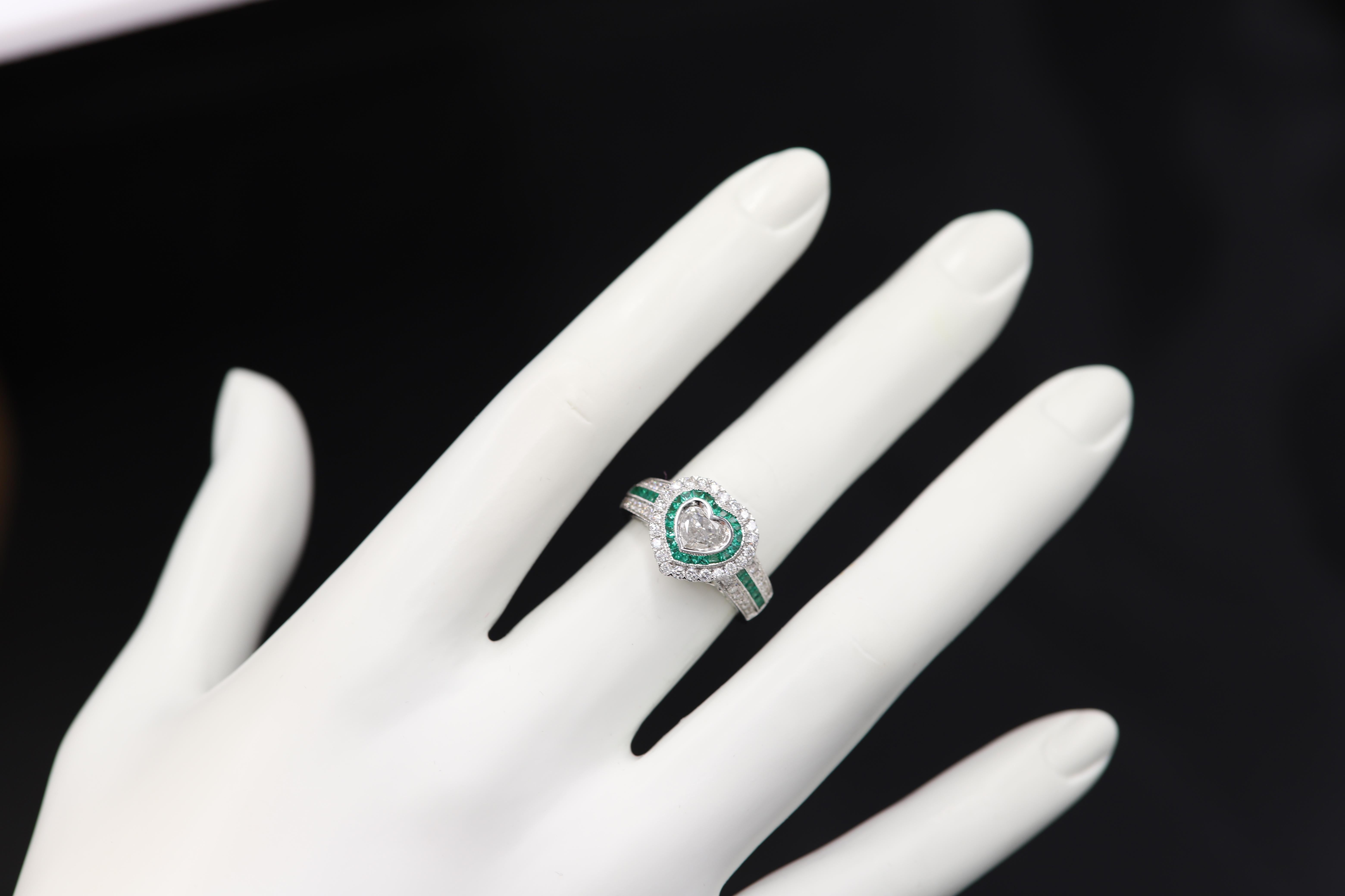 Brilliant Art Deco Style Ring Very special & unique, 18k White Gold 8.30 grams. Total all Diamonds 1.18 carat ( center stone is heart shape cut Diamond 0.44 carat IJ-I1 ) Emeralds total 0.71 carat. overall design area size on the top is, 13 mm.