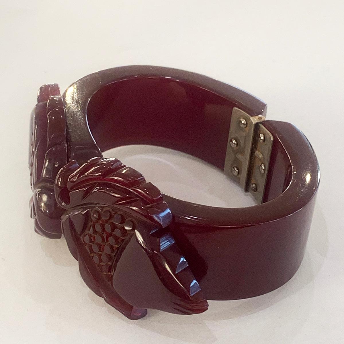 Art Deco Rare Dark Cherry Bakelite with asymmetrical Carvings of Fruit and Leaf to both left and right, hiding the joint below. All attachments, carvings and multi-screw hinges are all small screws, as expected. Hinge works perfectly and there is no