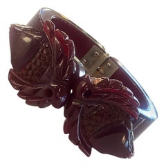 Art Deco Heavily carved dark red bakelite hinged clamper bangle bracelet