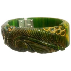 Art Deco heavily carved jade green marbled bakelite clamper hinged bracelet