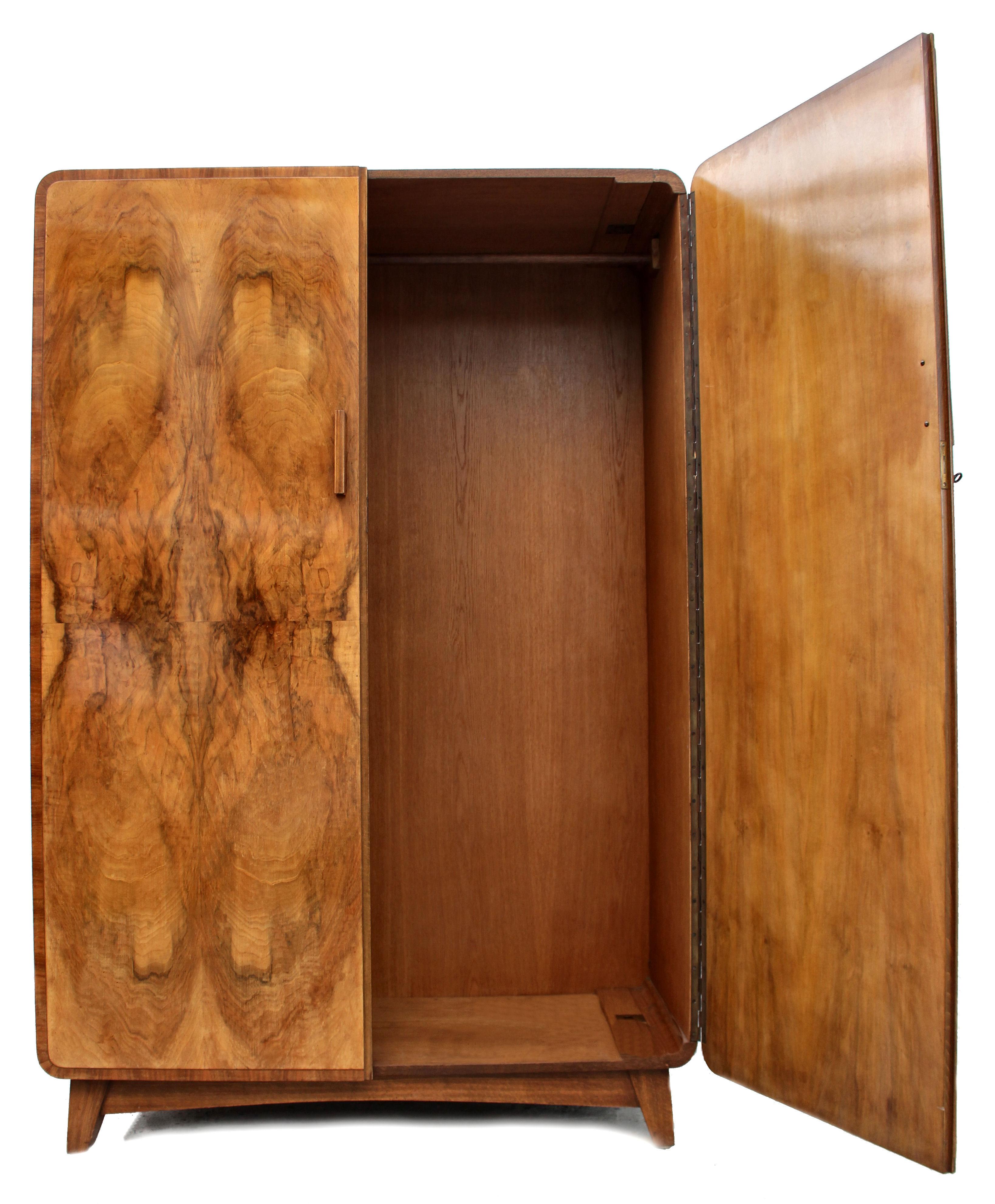 Superbly stylish Continental Art Deco wardrobe with the most glorious bookpage figured walnut veneers. This wardrobe also has a matching tallboy (see other listings). Aside looking very attractive and being functional this wardrobe is also of very