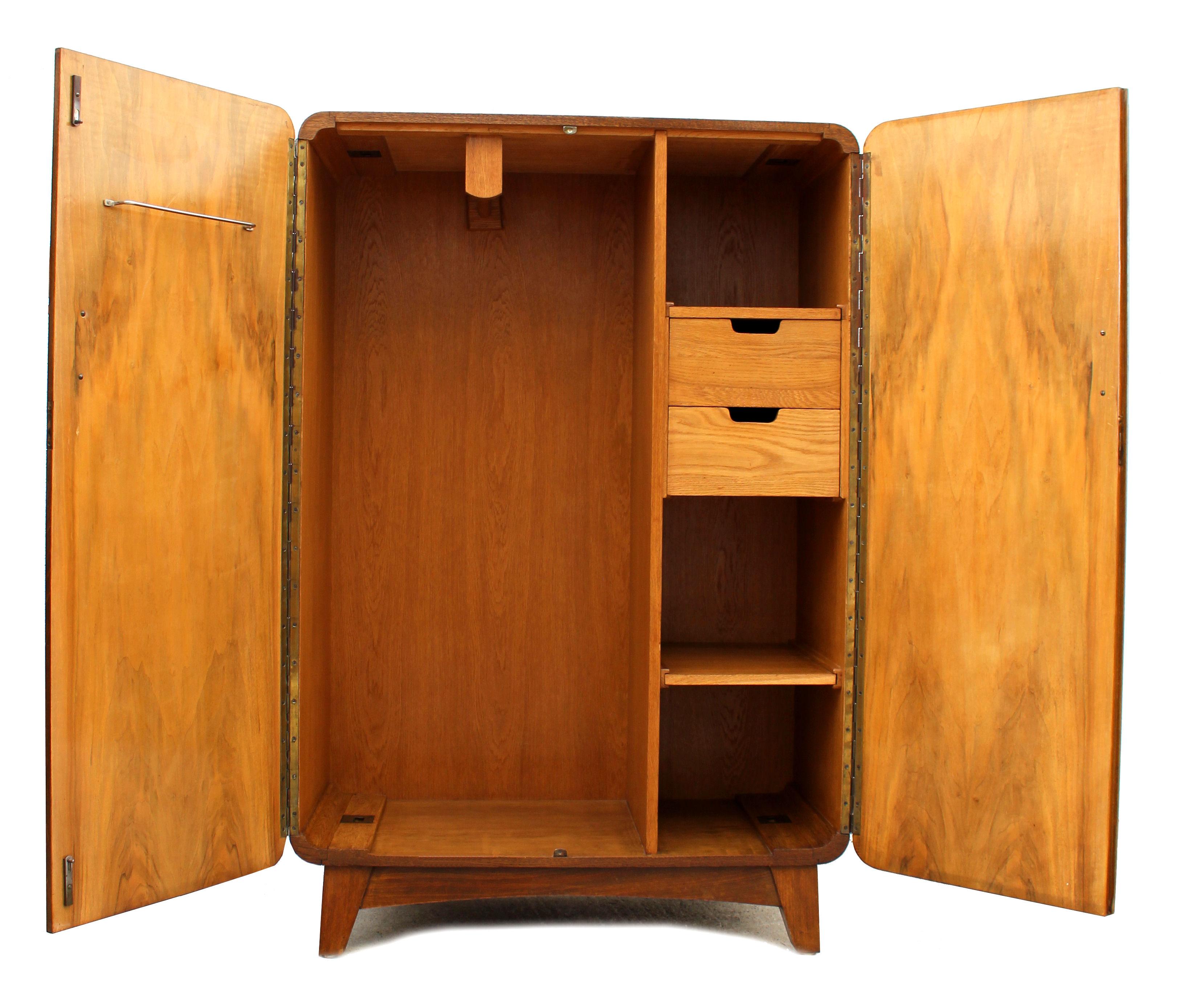 Superbly stylish continental Art Deco tallboy with the most glorious book page figured walnut veneers. This tallboy has a matching wardrobe (see other listings). Aside looking very attractive and being functional this tallboy is also of very good