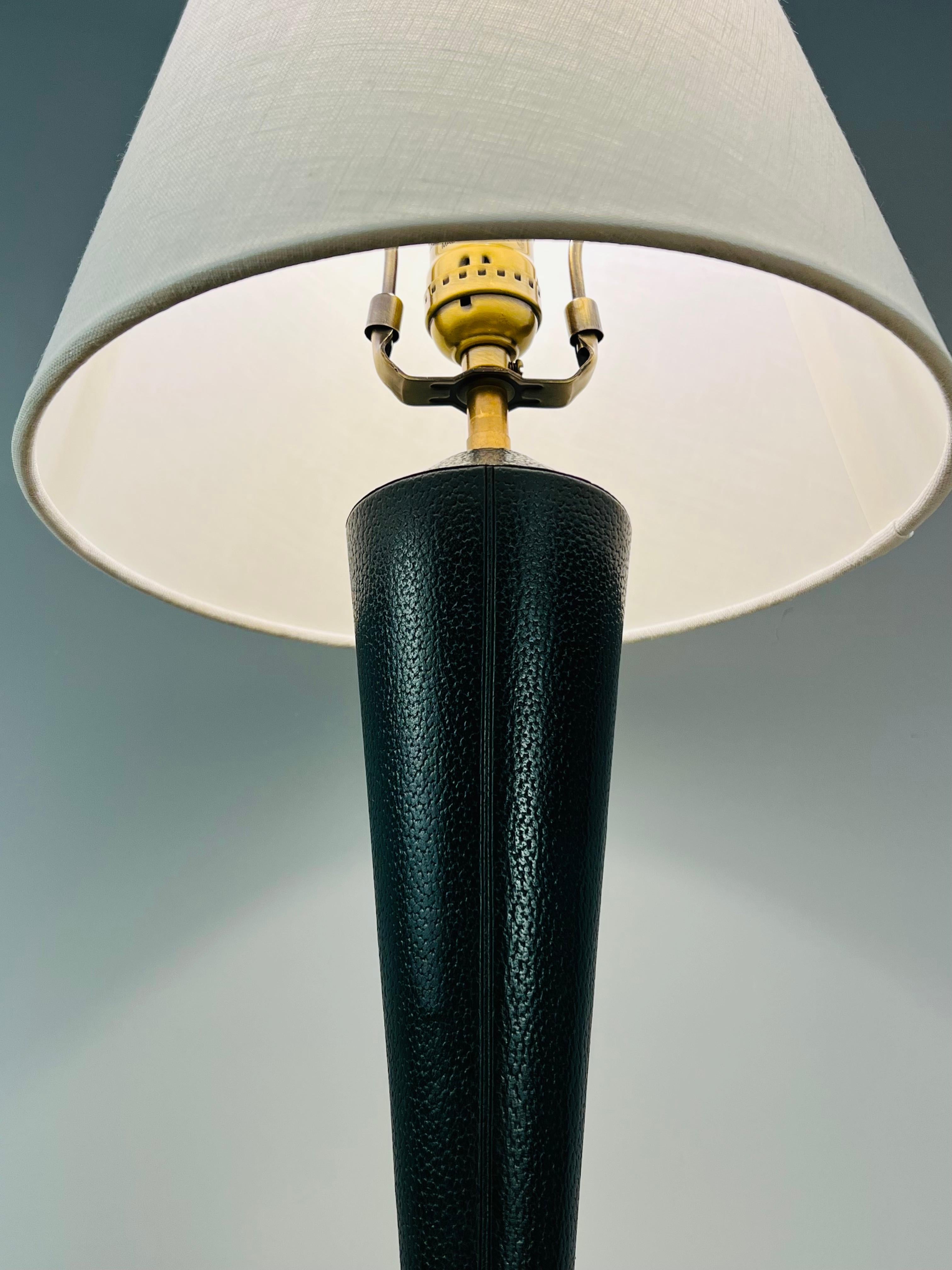 Art Deco small table lamp in the style of Jacques Adnet with a Hermes green color leather shaft.
Made in France
circa: 1940.